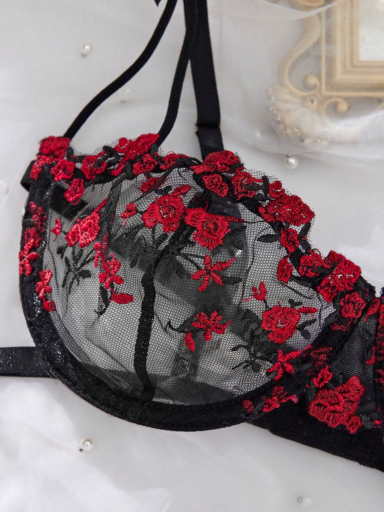 3-piece women’s lingerie set featuring a bandeau top and G-string thong, with embroidery, sheer details, knot accents, underwire demi bra styling, and adjustable spaghetti straps.