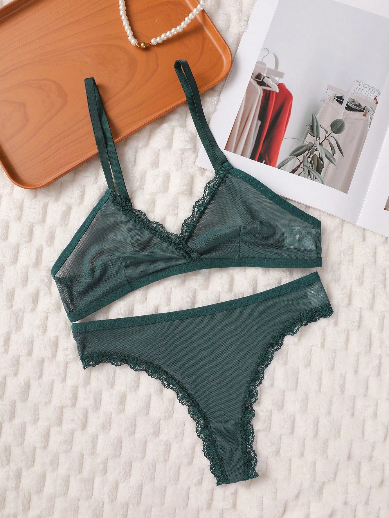 Dark green 2-piece lingerie set featuring a lace and mesh underwire bralette with adjustable straps and a matching mid-rise thong.