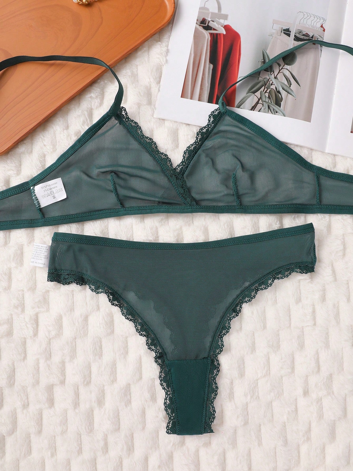 Dark green 2-piece lingerie set featuring a lace and mesh underwire bralette with adjustable straps and a matching mid-rise thong.