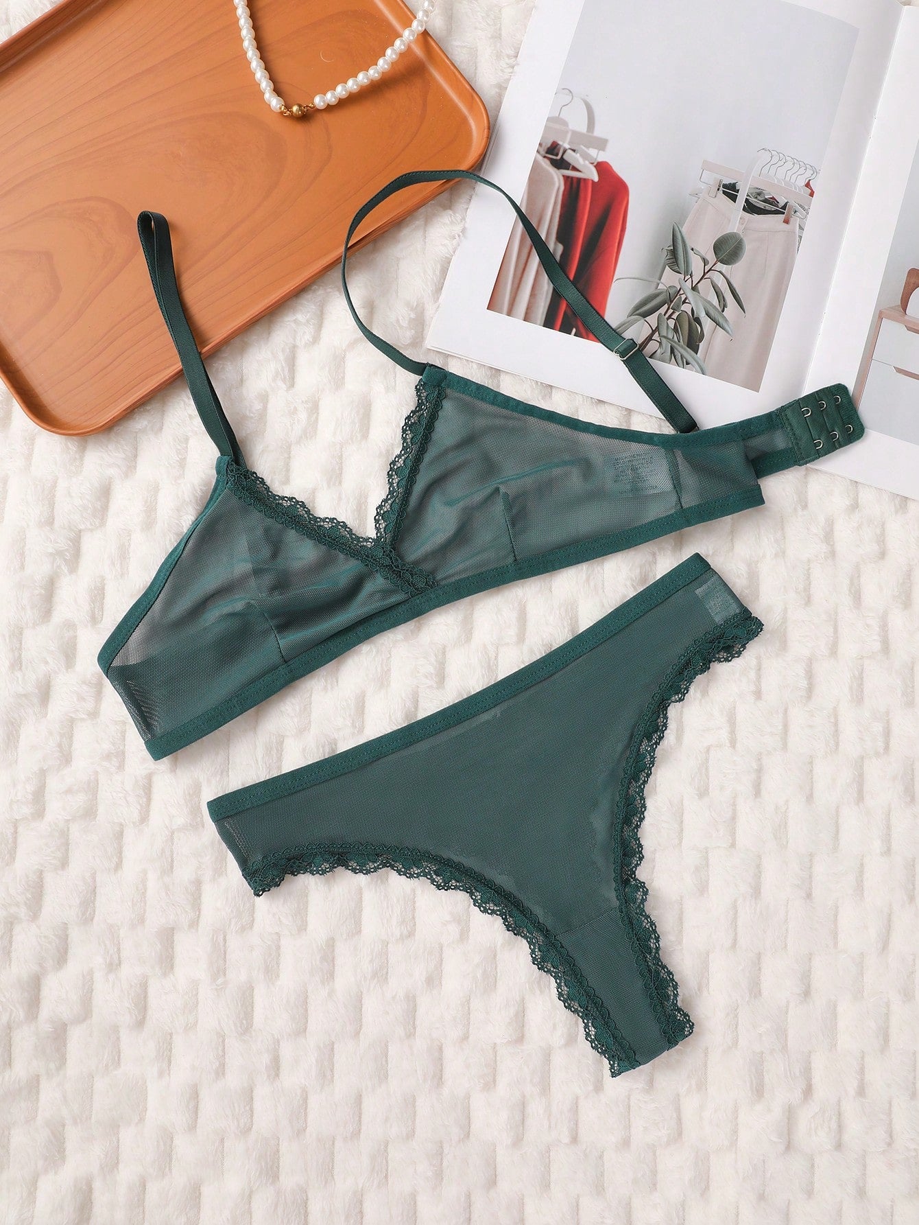 Dark green 2-piece lingerie set featuring a lace and mesh underwire bralette with adjustable straps and a matching mid-rise thong.
