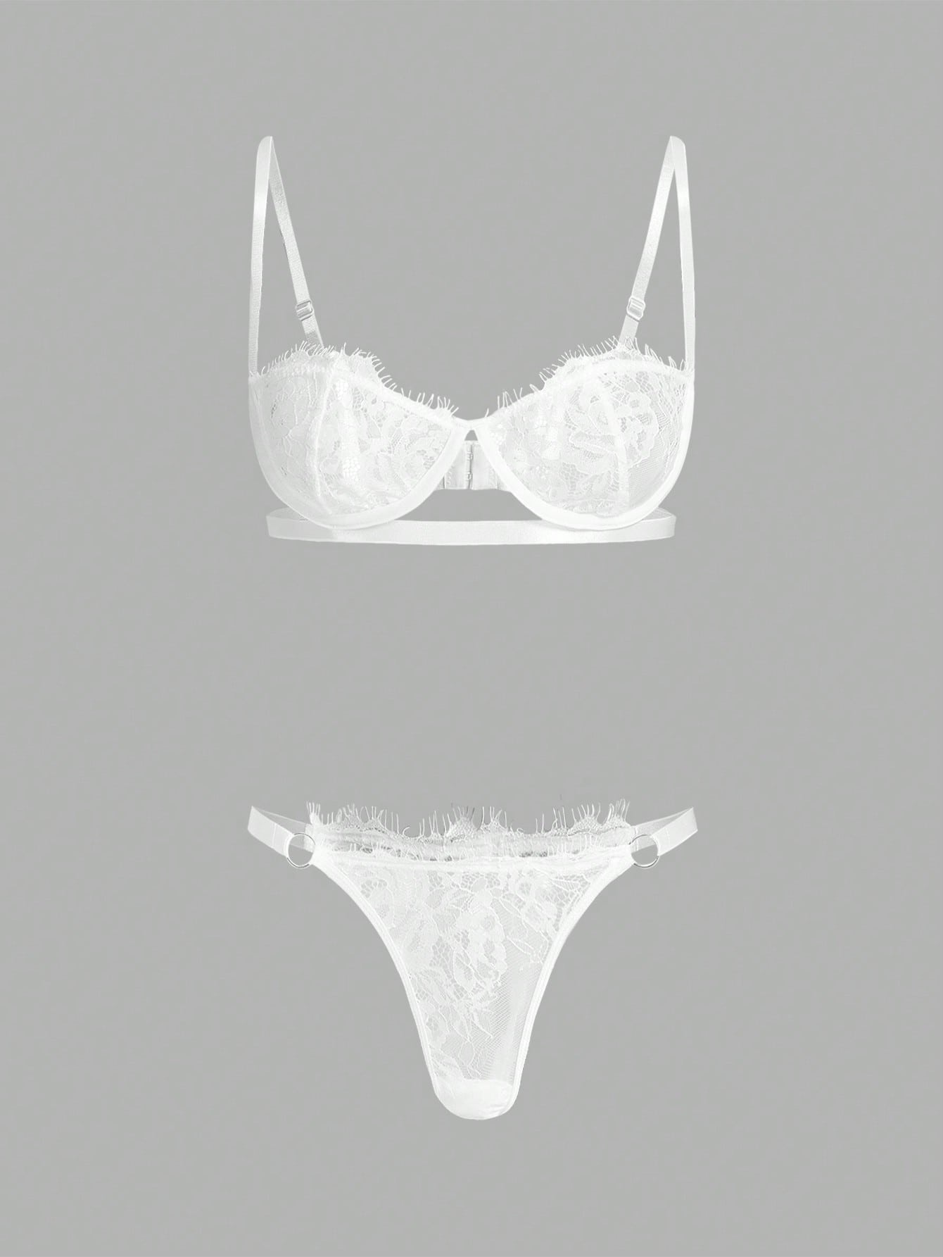 Two-piece floral lace lingerie set featuring an underwire balconette bra with adjustable straps and a matching low-rise thong panty, semi-sheer with slight stretch, shown in white and available in royal blue.