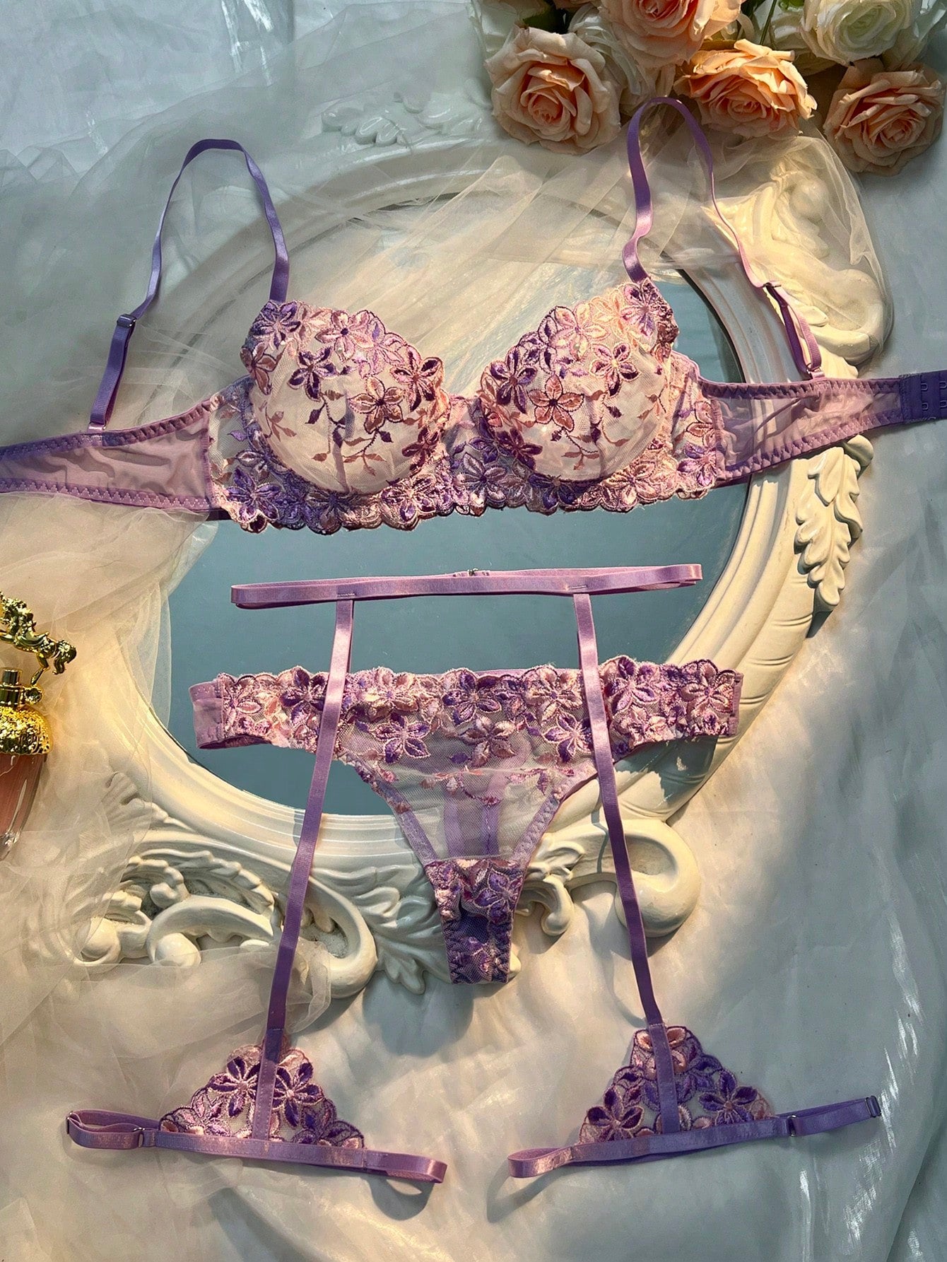 Three-piece women’s sexy lingerie set featuring floral embroidery and sheer details, with a spaghetti strap underwire bralette and matching low-rise briefs.