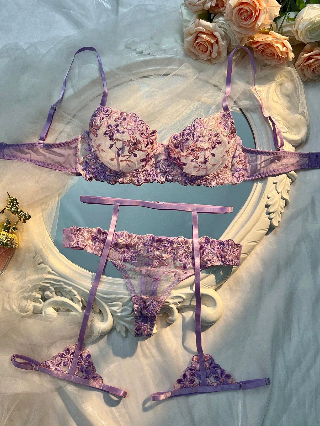 Three-piece women’s sexy lingerie set featuring floral embroidery and sheer details, with a spaghetti strap underwire bralette and matching low-rise briefs.