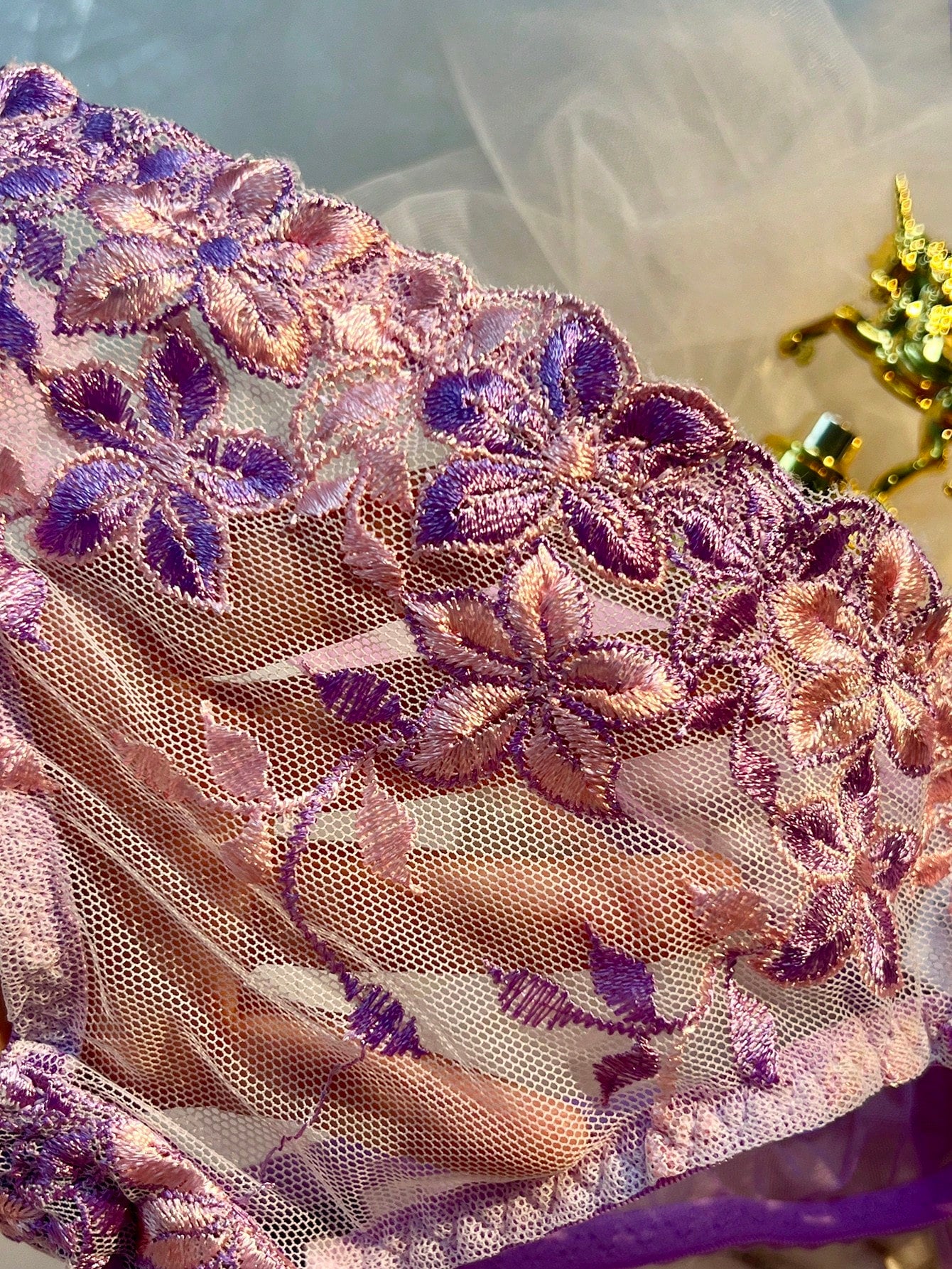 Three-piece women’s sexy lingerie set featuring floral embroidery and sheer details, with a spaghetti strap underwire bralette and matching low-rise briefs.