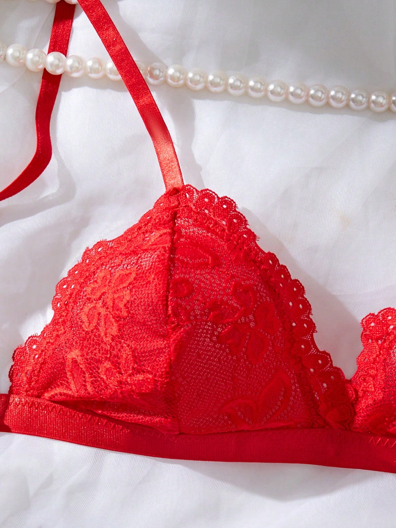 Women’s 2-piece lace patchwork solid-color lingerie set with a spaghetti-strap crossback bralette and low-rise thong panty, styled for romantic or festival looks.