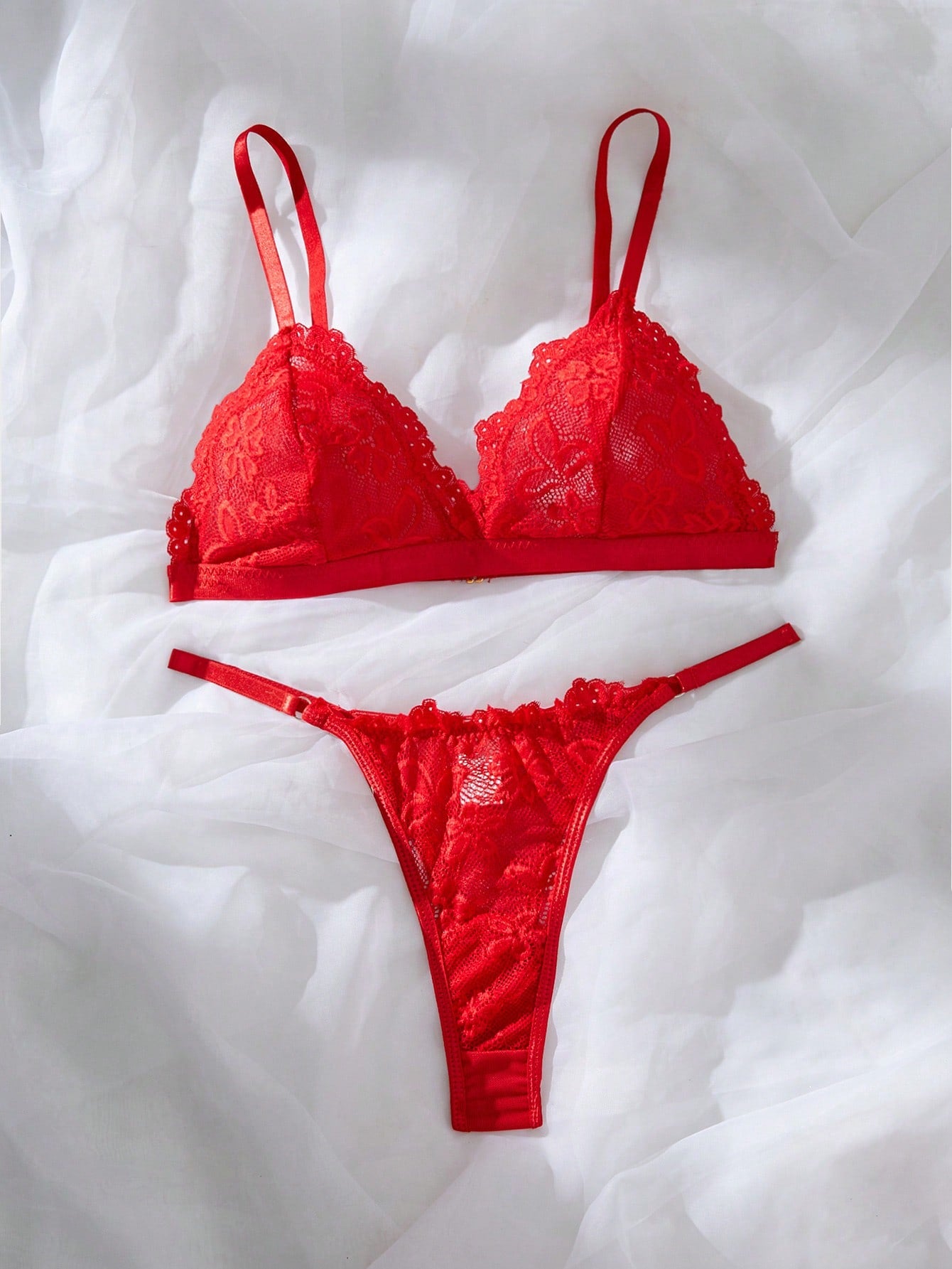 Women’s 2-piece lace patchwork solid-color lingerie set with a spaghetti-strap crossback bralette and low-rise thong panty, styled for romantic or festival looks.