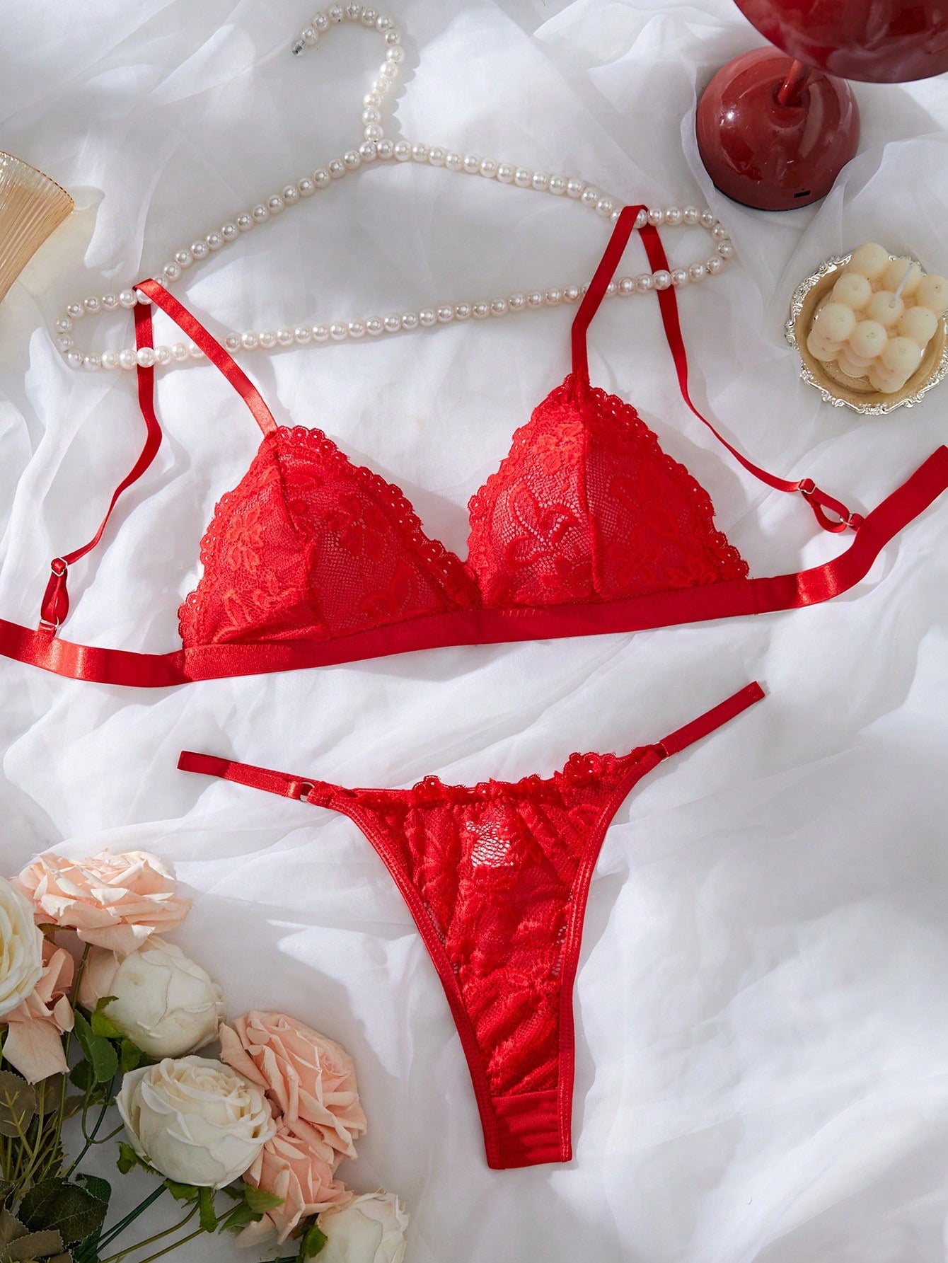 Women’s 2-piece lace patchwork solid-color lingerie set with a spaghetti-strap crossback bralette and low-rise thong panty, styled for romantic or festival looks.