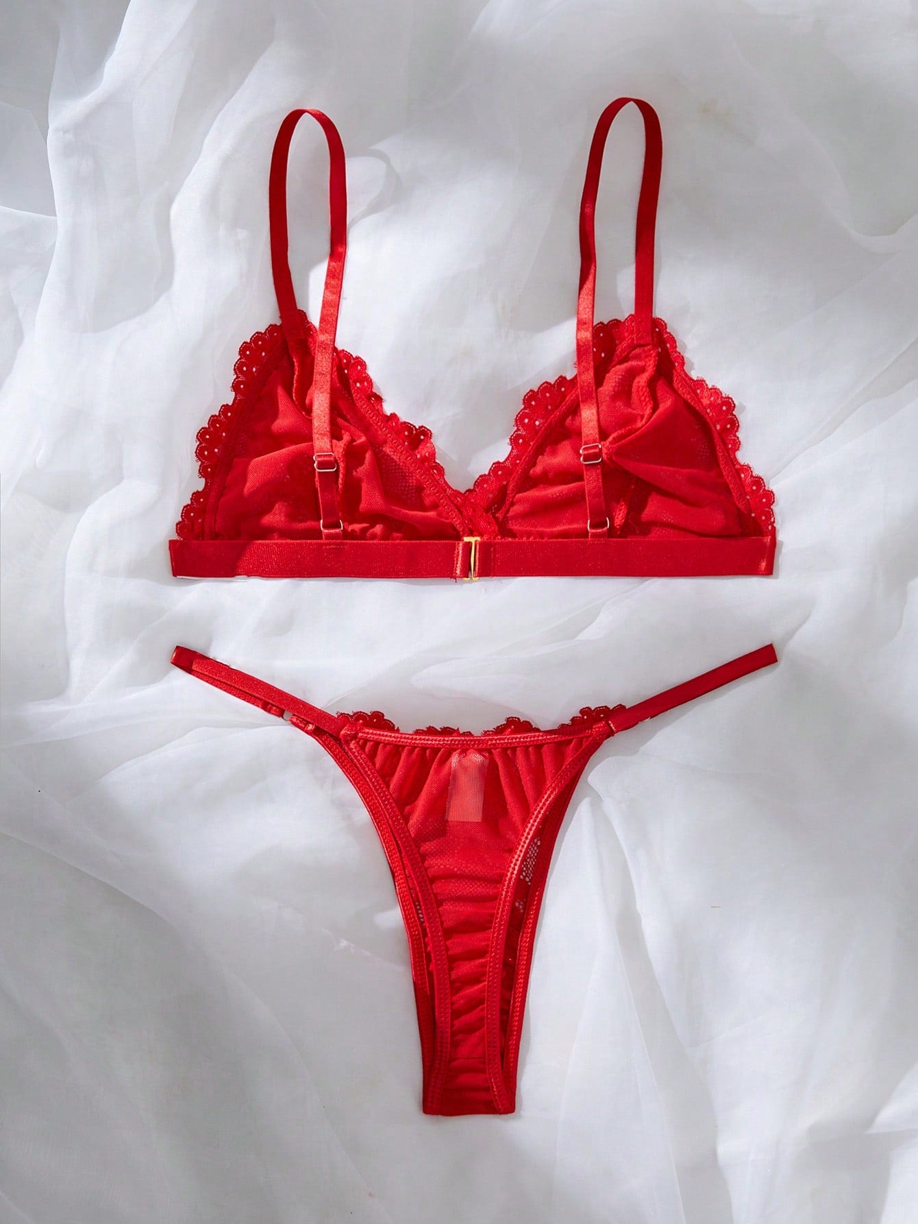 Women’s 2-piece lace patchwork solid-color lingerie set with a spaghetti-strap crossback bralette and low-rise thong panty, styled for romantic or festival looks.
