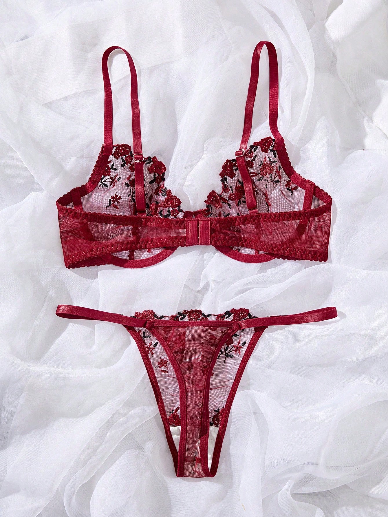 Women's floral embroidered sheer mesh lingerie set featuring a spaghetti strap camisole-style bralette with adjustable straps and a matching low-rise thong.