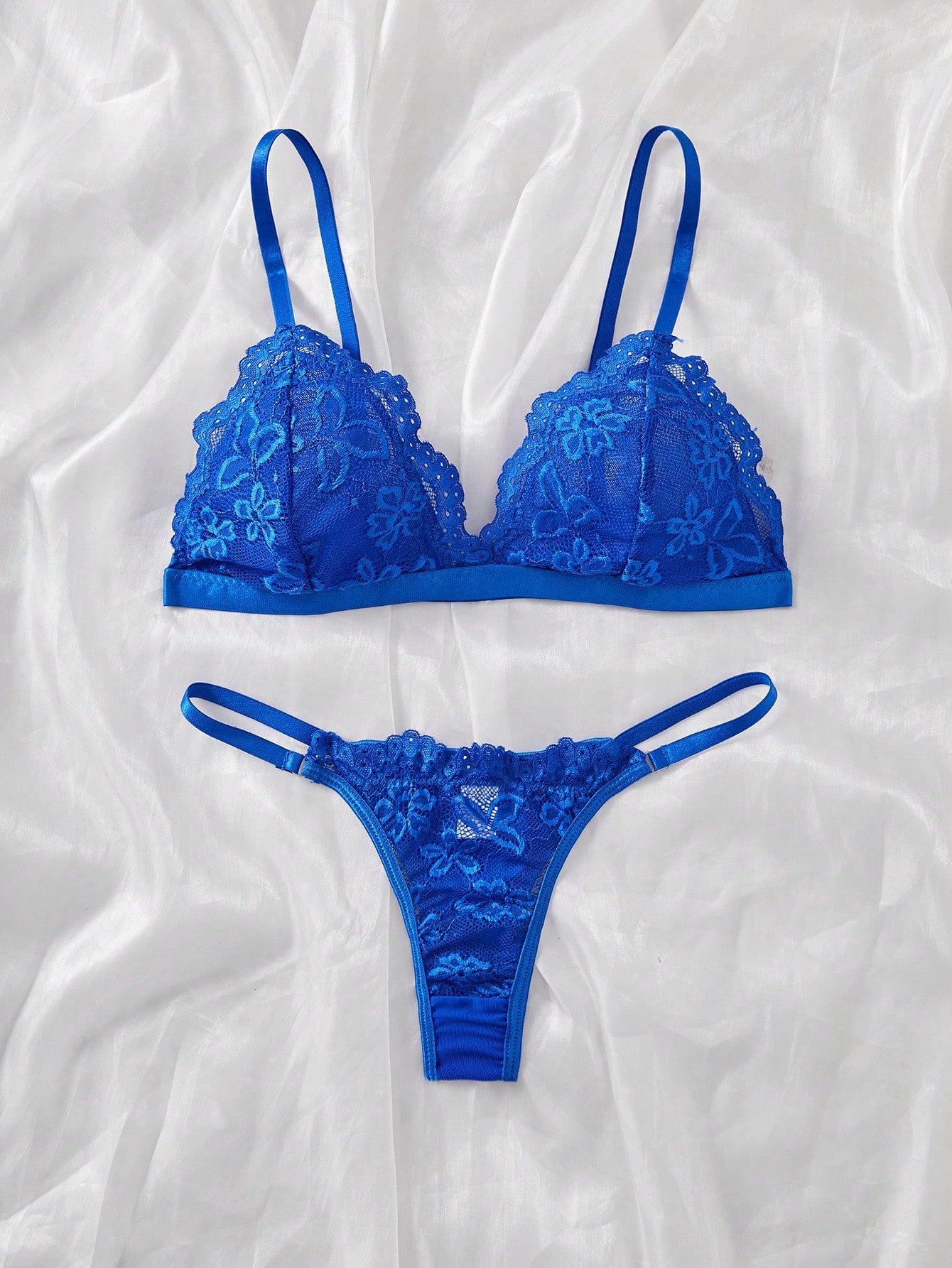 Women's 2-piece lingerie set with a solid color lace patchwork cami bralette featuring spaghetti straps and a crossback design, paired with a matching low-rise thong panty.