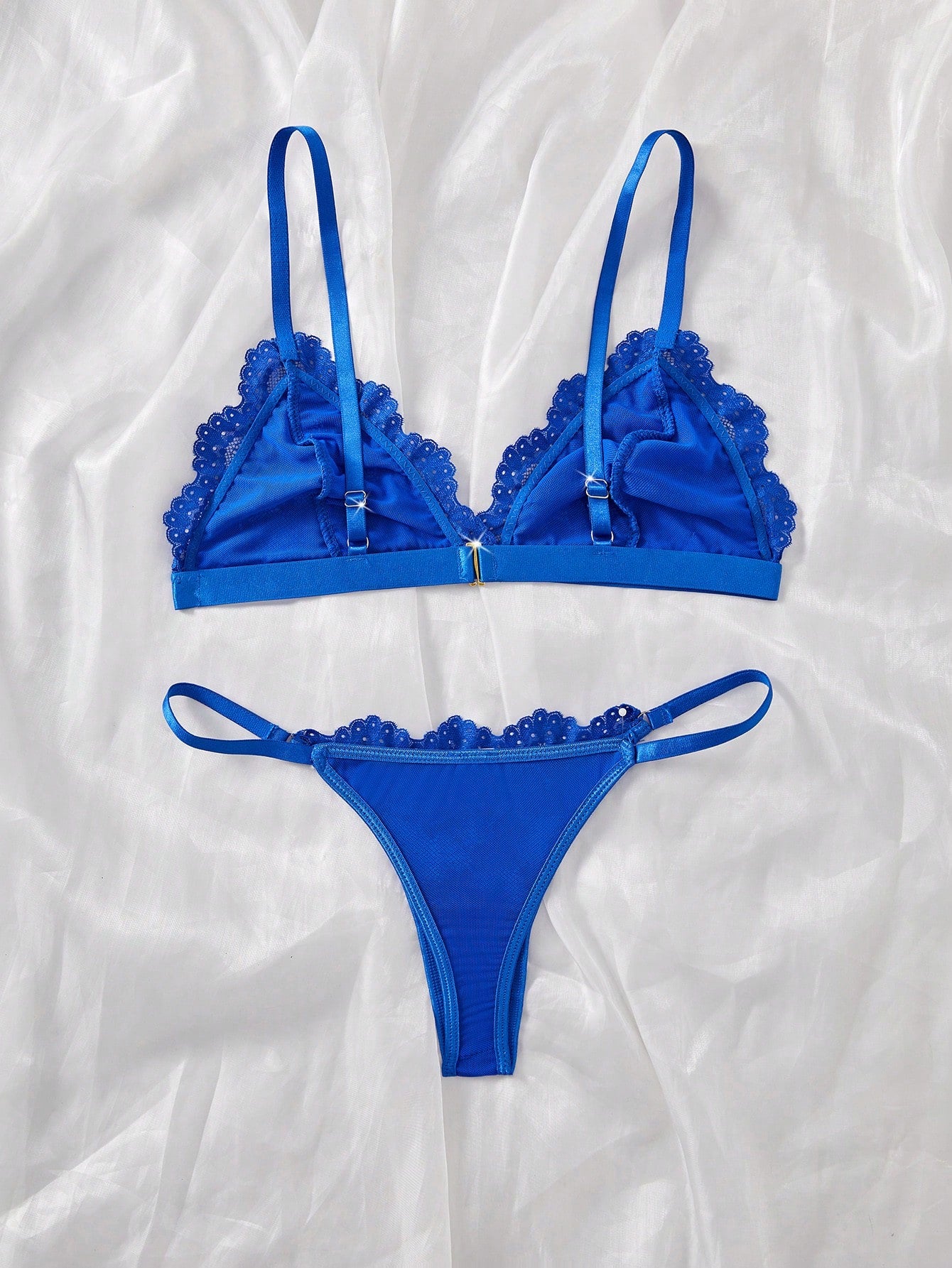 Women’s 2-piece lace patchwork solid-color lingerie set with a spaghetti-strap crossback bralette and low-rise thong panty, styled for romantic or festival looks.
