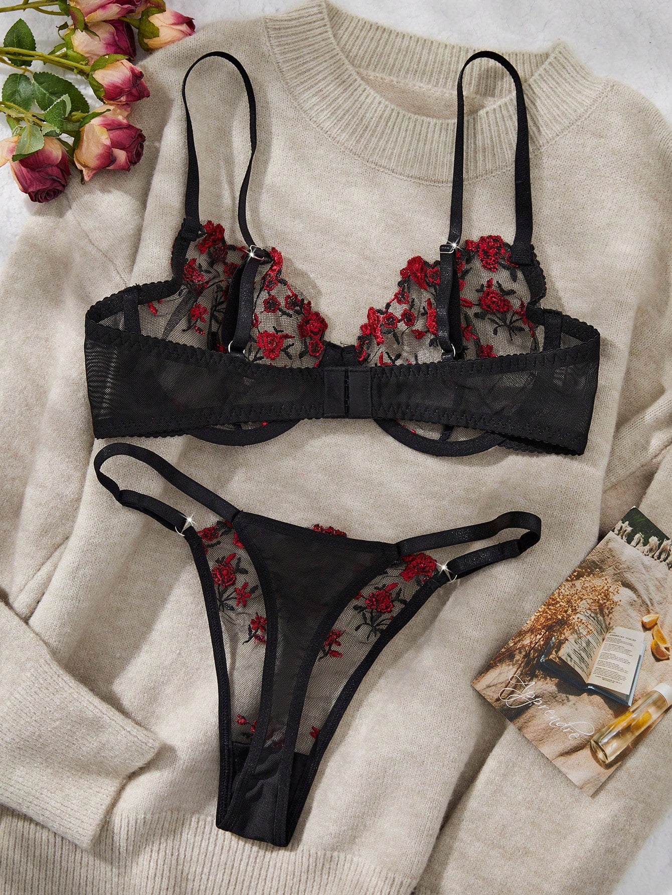 Women's floral embroidered sheer mesh lingerie set featuring a spaghetti strap camisole-style bralette with adjustable straps and a matching low-rise thong.