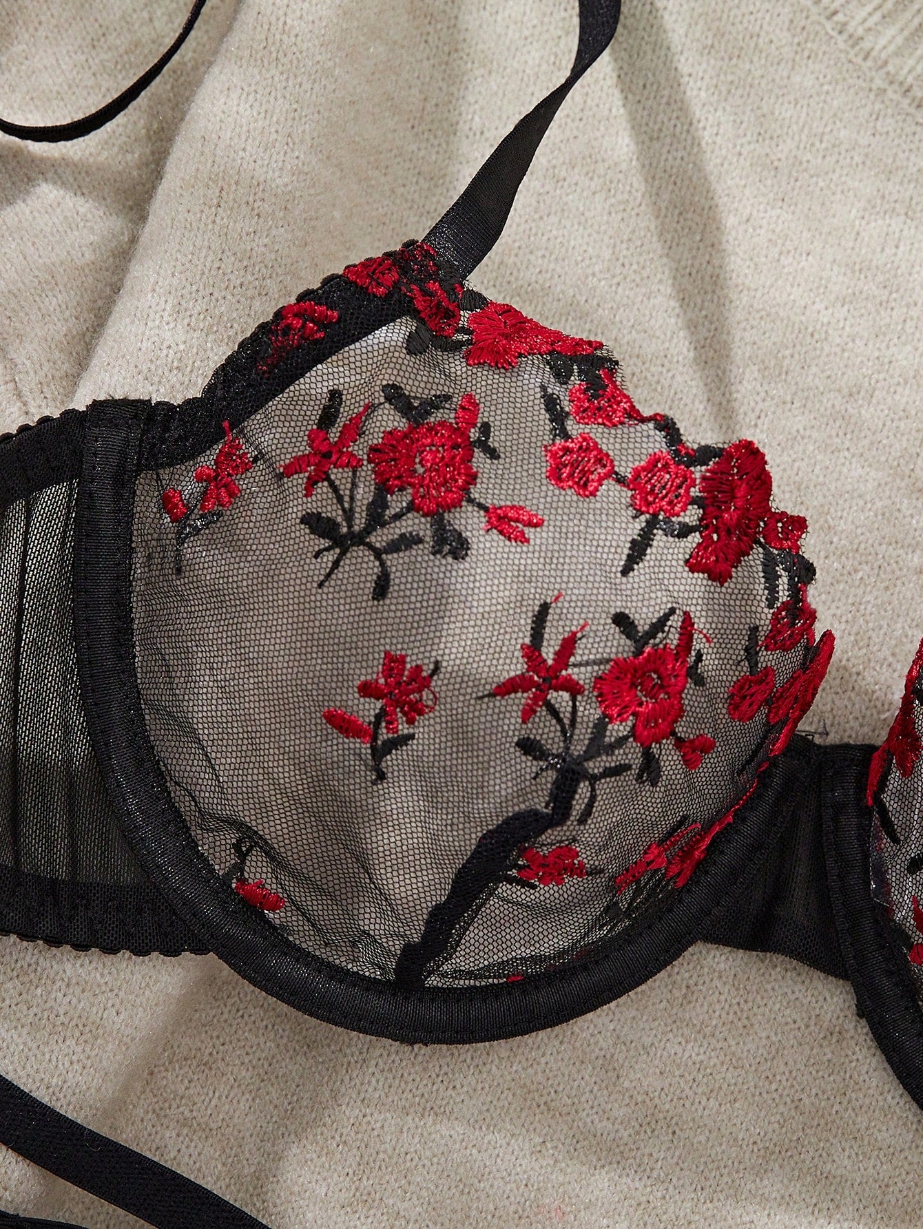 Women's floral embroidered sheer mesh lingerie set featuring a spaghetti strap camisole-style bralette with adjustable straps and a matching low-rise thong.