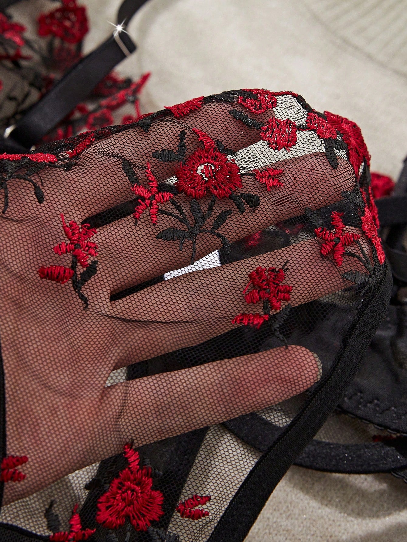 Women's floral embroidered sheer mesh lingerie set featuring a spaghetti strap camisole-style bralette with adjustable straps and a matching low-rise thong.