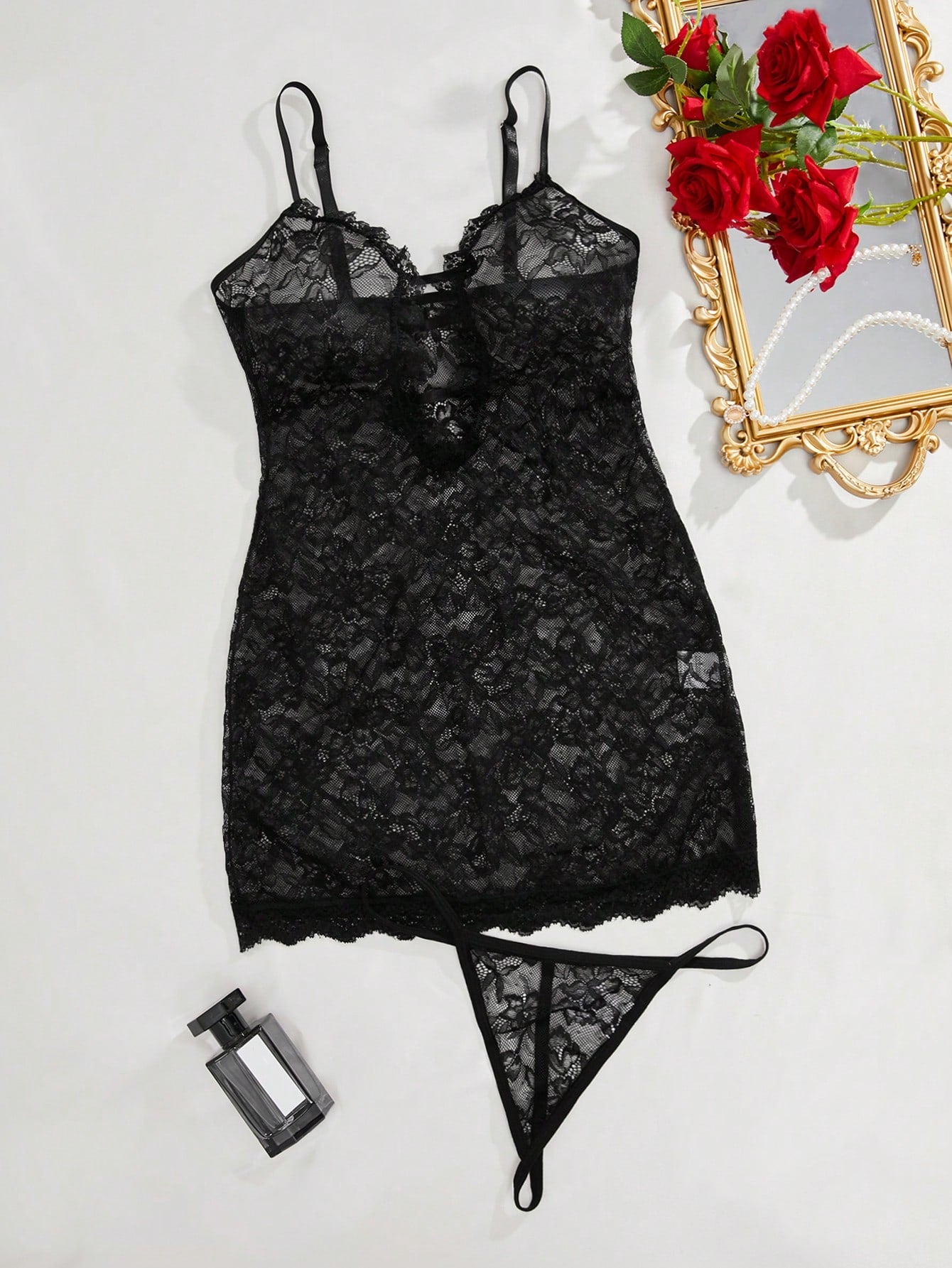 Two-piece sexy lingerie set featuring a short lace slip dress with cutout detail, backless crisscross design, spaghetti straps, and a matching thong.