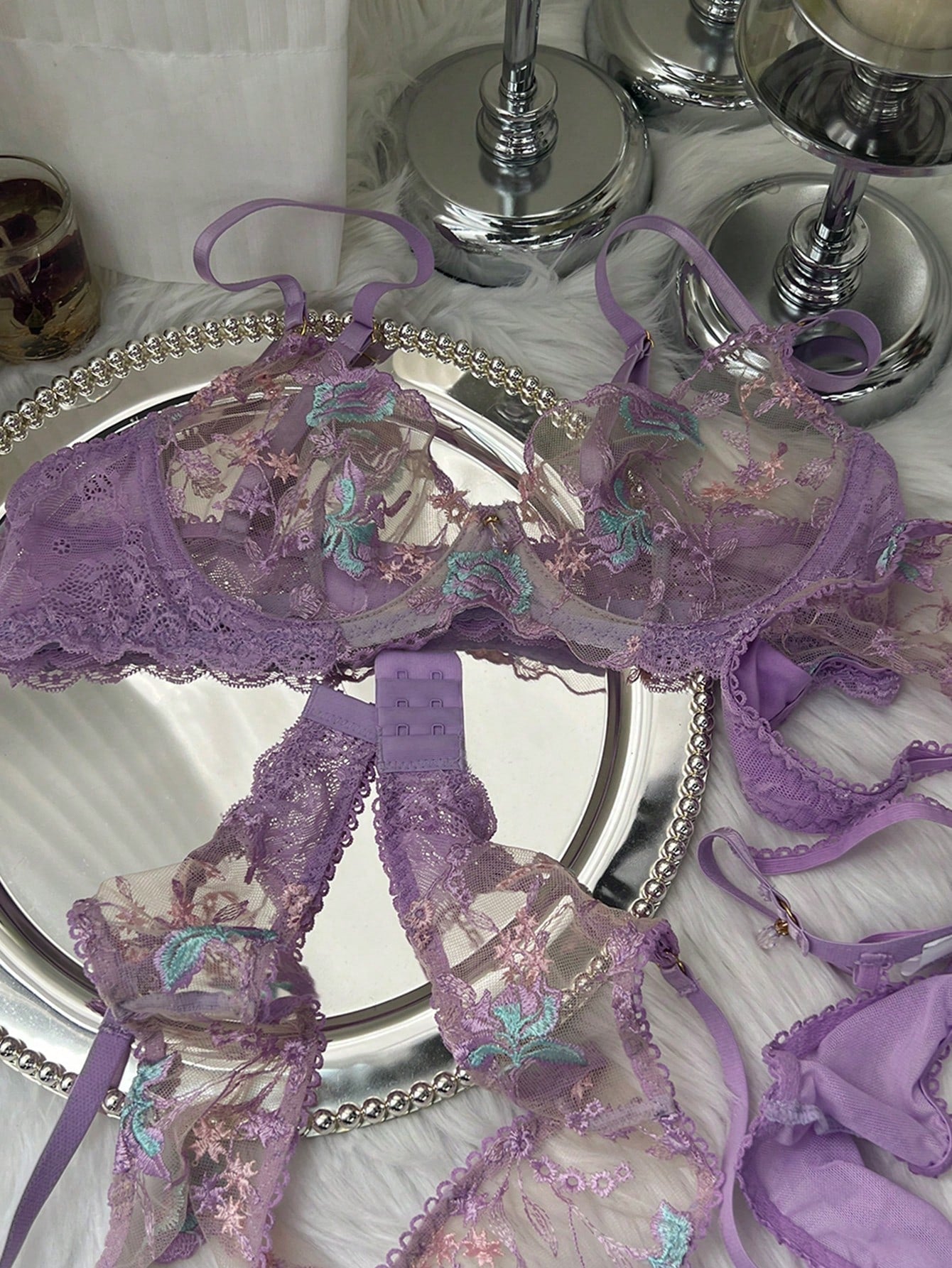 Women's romantic purple lingerie set with embroidered sheer bralette and matching thongs, featuring underwire support, triangle cups, and adjustable spaghetti straps in a 5-piece set.