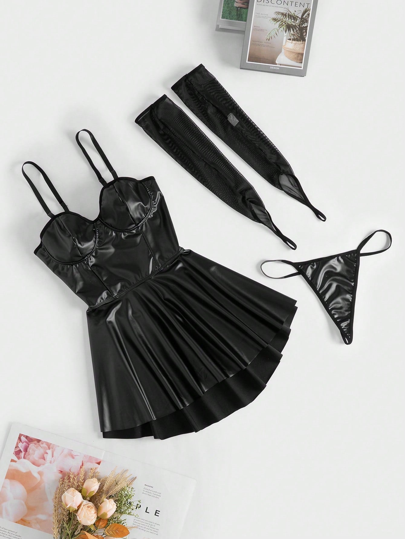 Black goth-style PU lingerie dress with a cut-out back, spaghetti straps, and contrast mesh details, shown with matching thong and arm sleeves in a 4-piece set.
