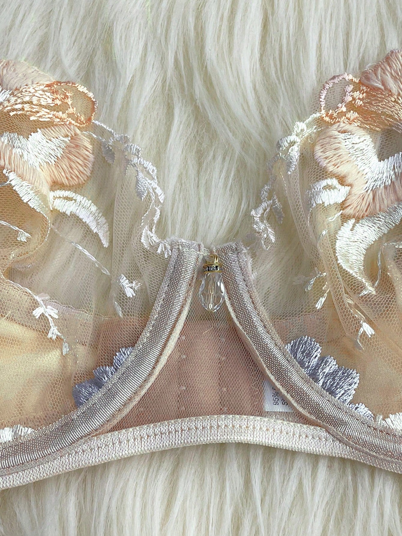 Apricot embroidered sexy lingerie set with an underwire triangle cup bra, matching thong, waistband, and legband in a sheer fantasy-gorgeous style.
