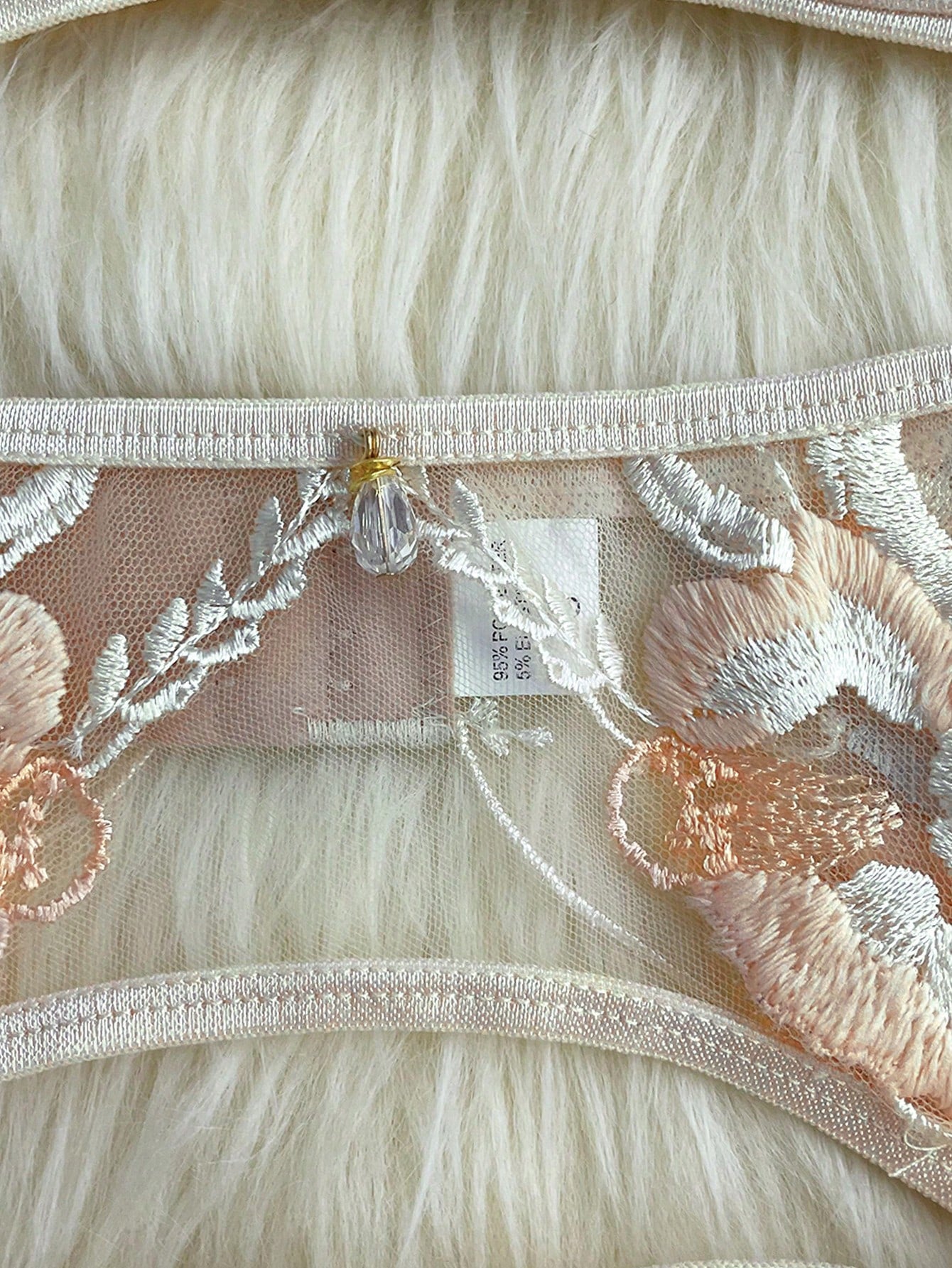 Apricot embroidered sexy lingerie set with an underwire triangle cup bra, matching thong, waistband, and legband in a sheer fantasy-gorgeous style.