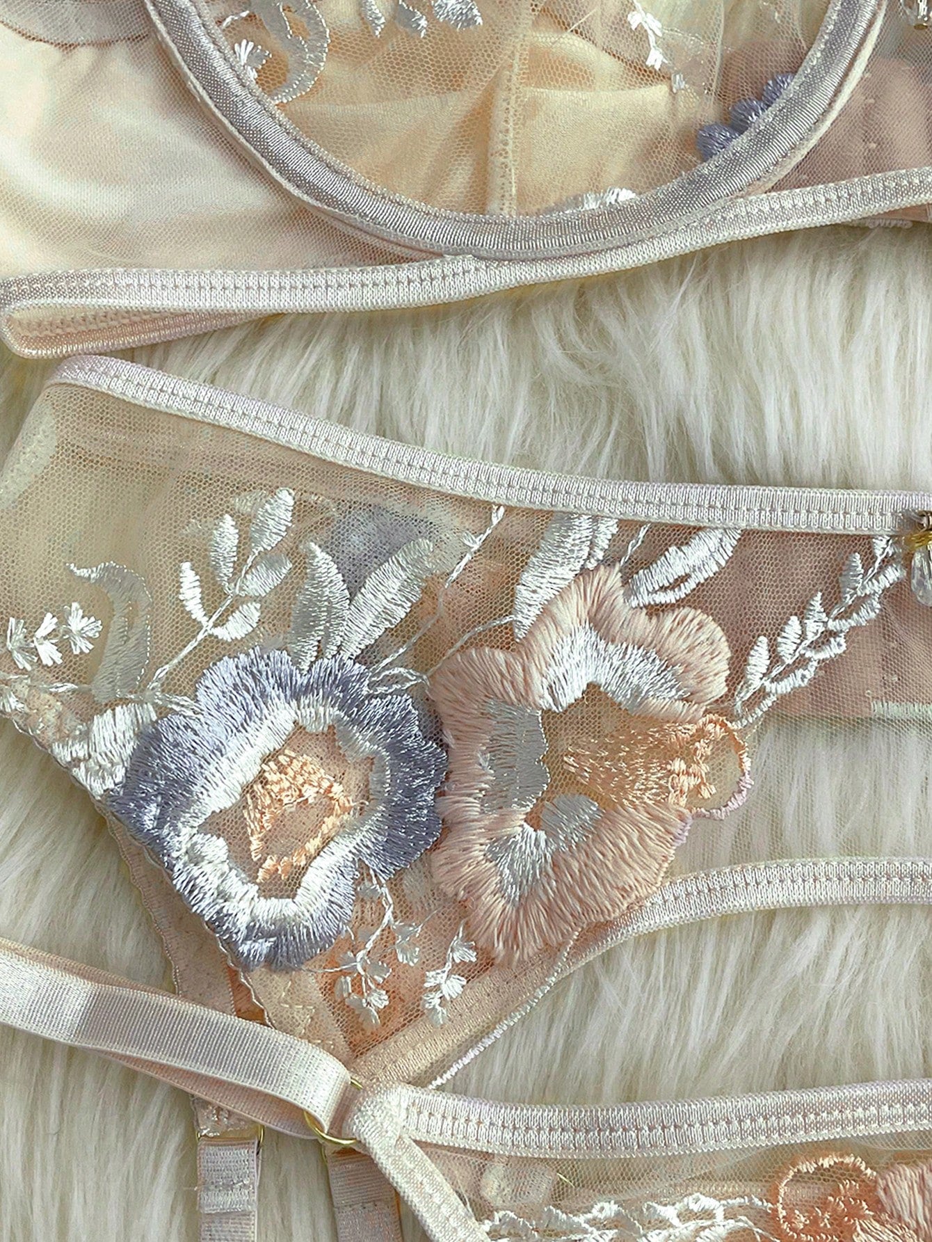 Apricot embroidered sexy lingerie set with an underwire triangle cup bra, matching thong, waistband, and legband in a sheer fantasy-gorgeous style.