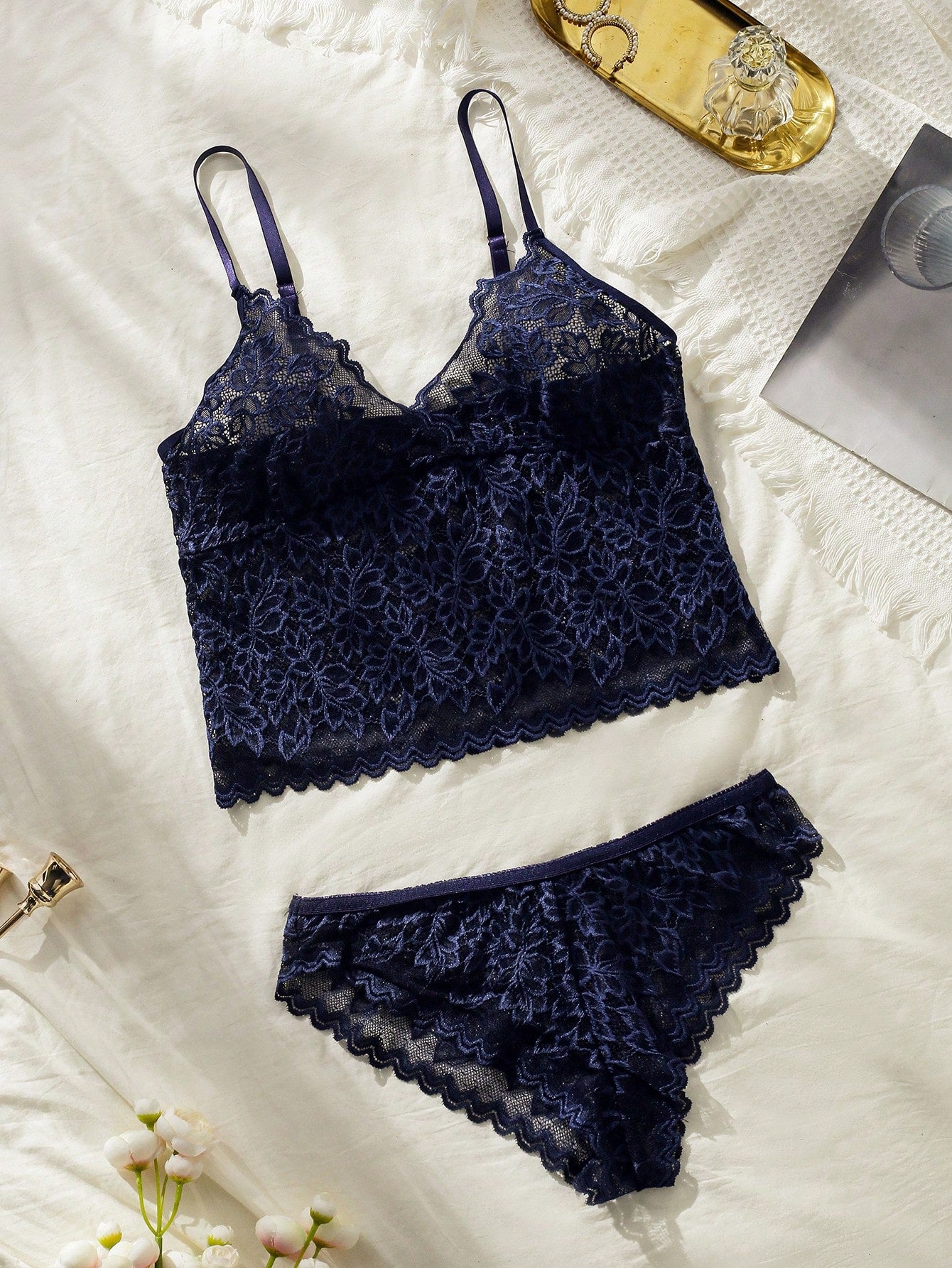 Women's romantic French-style lace lingerie set with scallop details, featuring a longline bra with spaghetti adjustable straps and matching mid-rise bikini panty in a plain pattern.