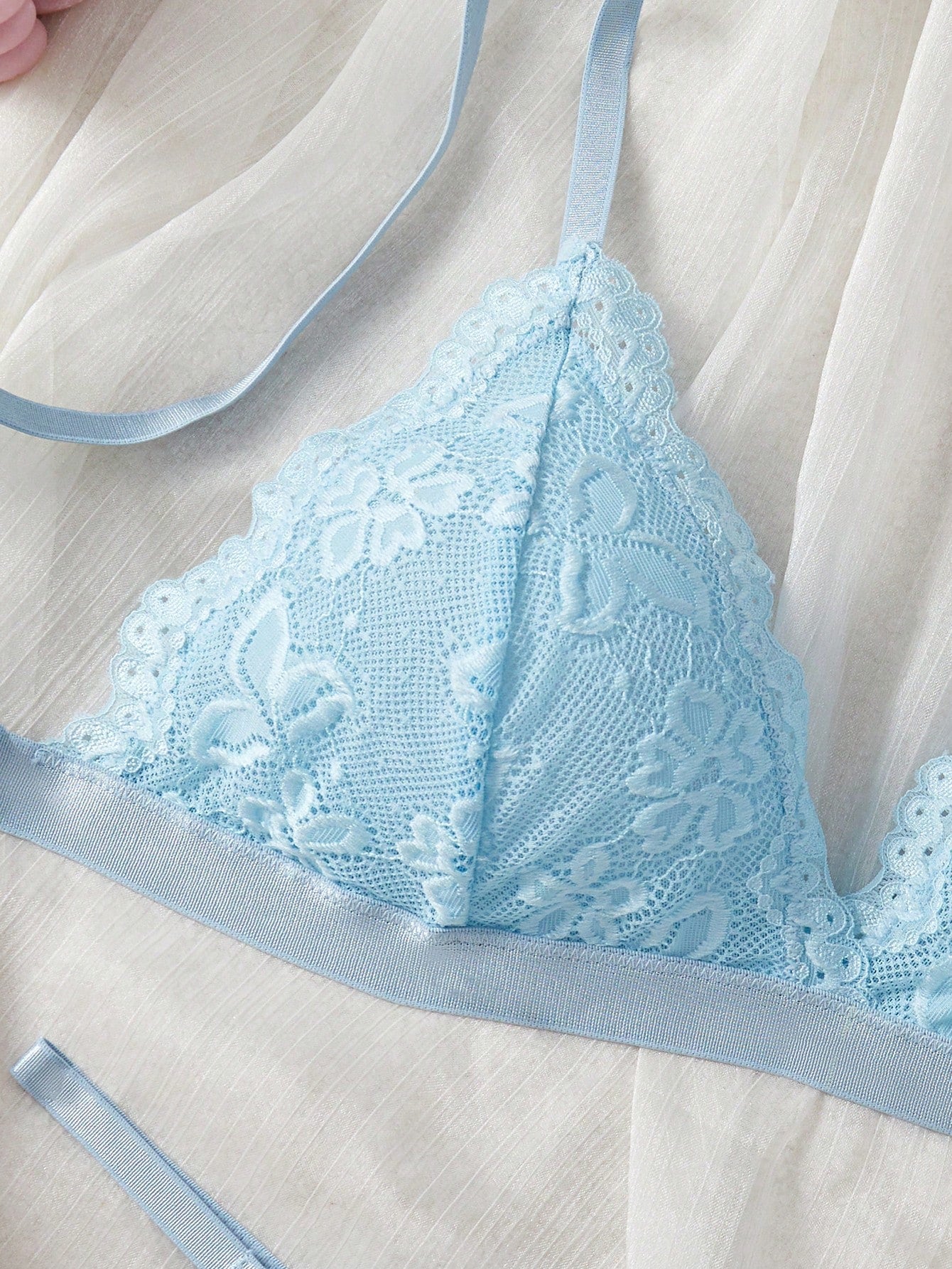 Women’s 2-piece lace patchwork solid-color lingerie set with a spaghetti-strap crossback bralette and low-rise thong panty, styled for romantic or festival looks.