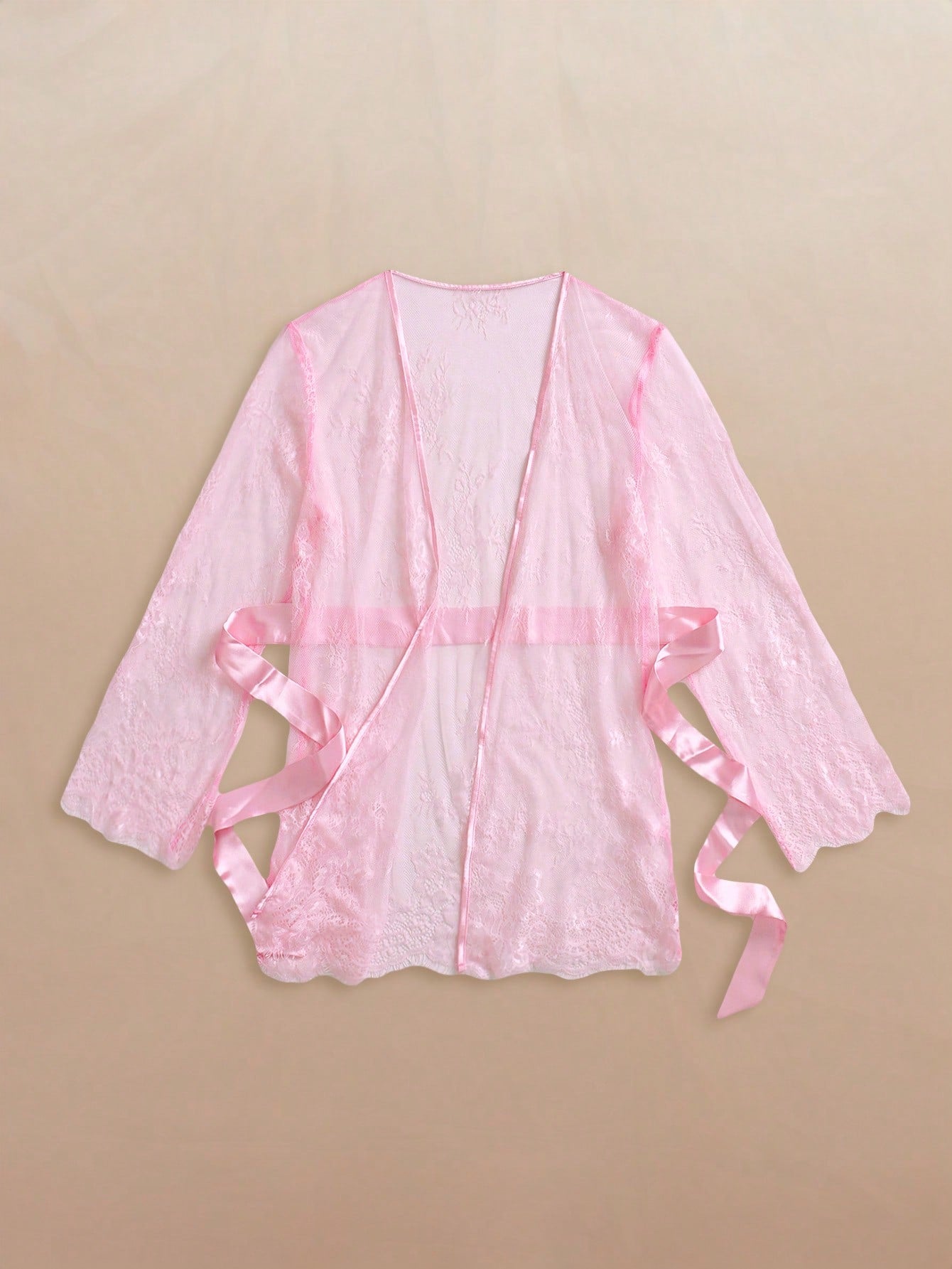 Two-piece women’s lingerie set featuring a floral lace plunging teddy bodysuit with adjustable spaghetti straps and a matching short belted robe with long sleeves and semi-sheer lace detail.