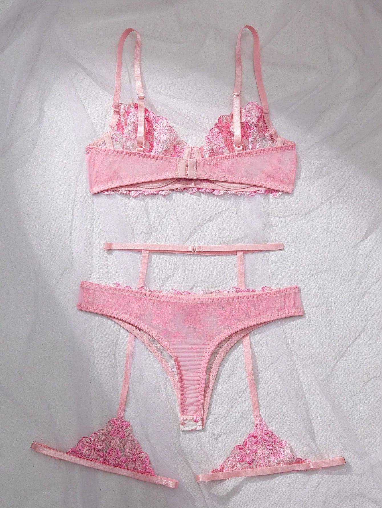 Three-piece women’s sexy lingerie set featuring floral embroidery and sheer details, with a spaghetti strap underwire bralette and matching low-rise briefs.