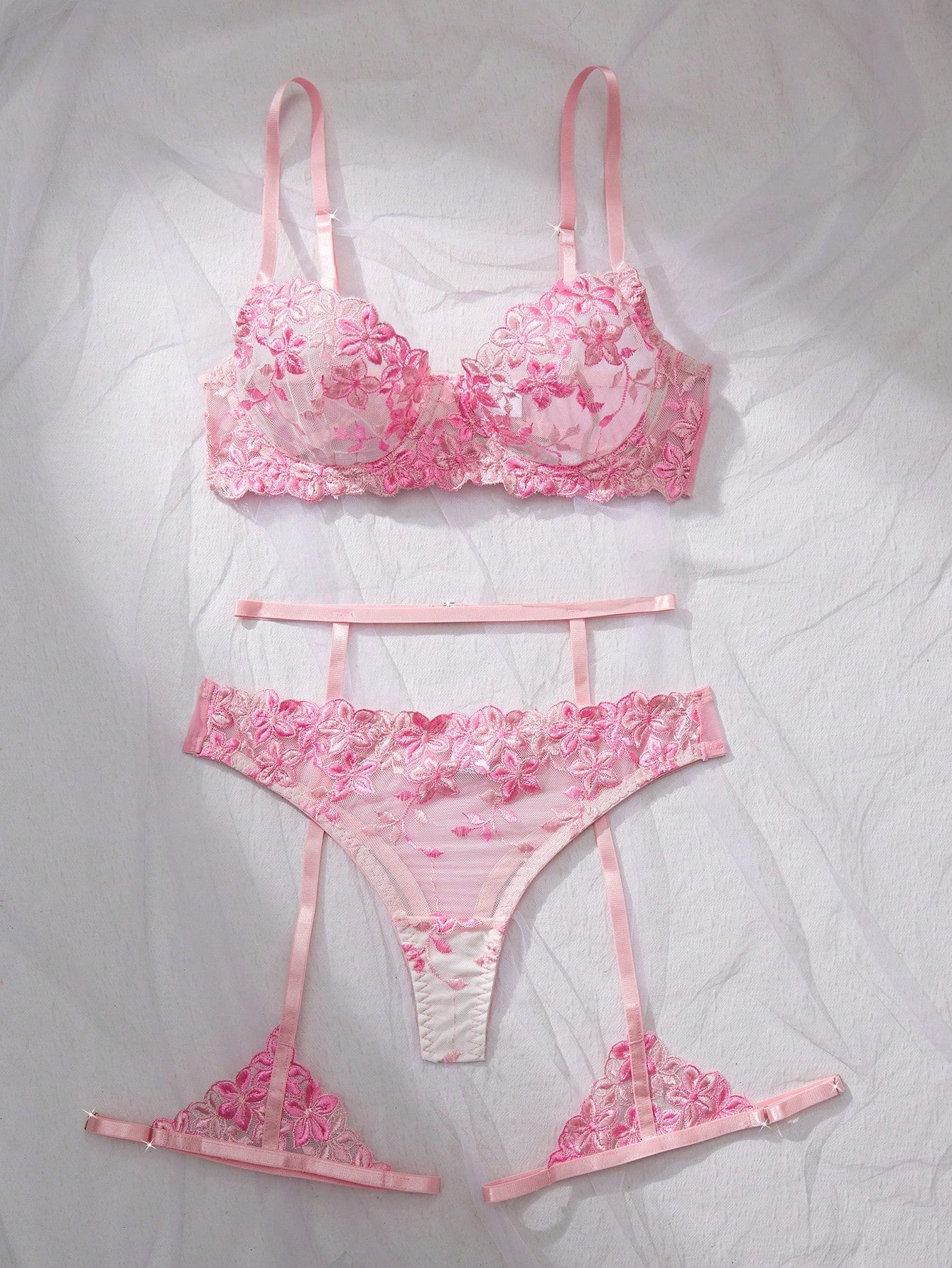 Three-piece women’s sexy lingerie set featuring floral embroidery and sheer details, with a spaghetti strap underwire bralette and matching low-rise briefs.