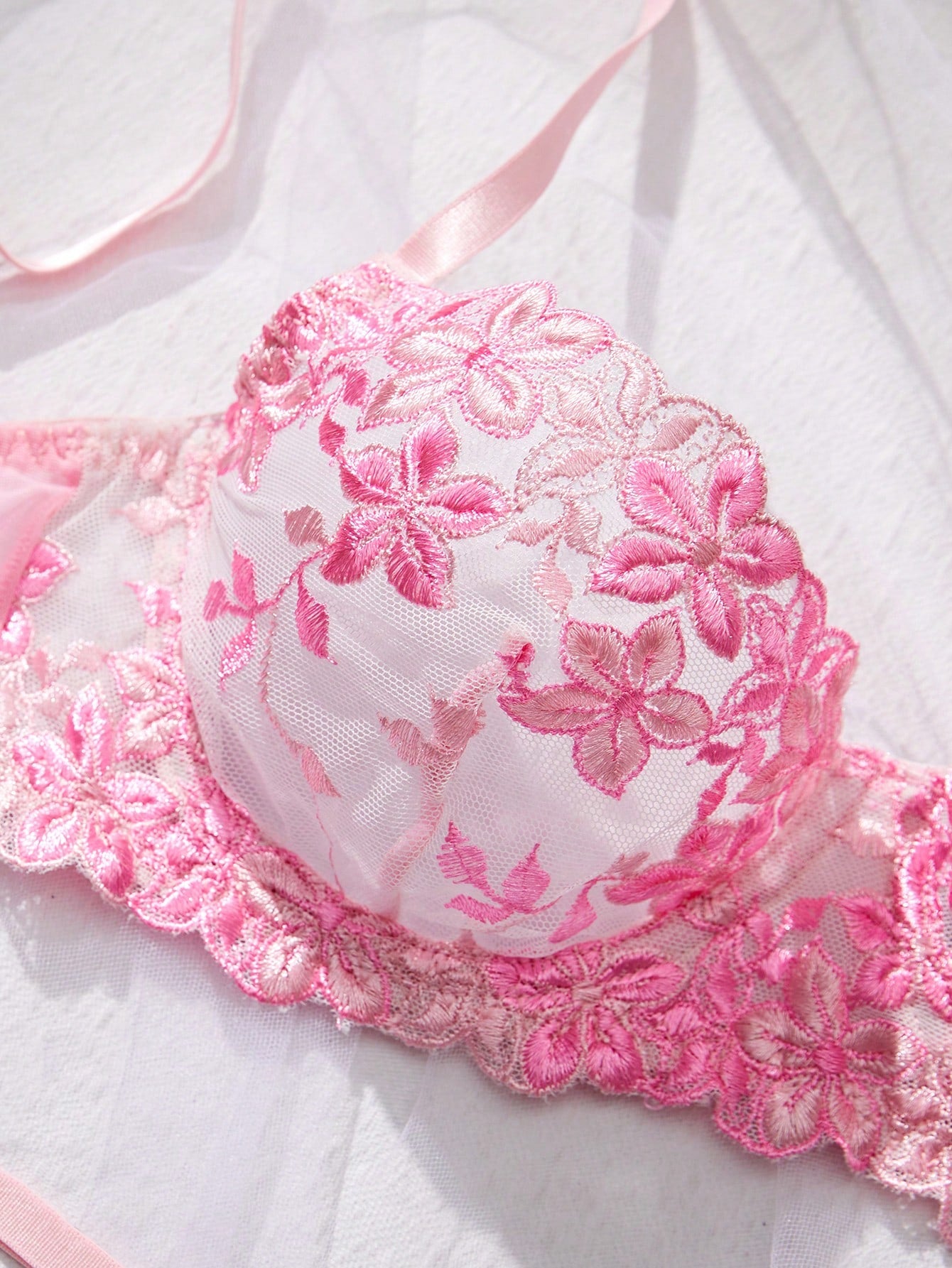 Three-piece women’s sexy lingerie set featuring floral embroidery and sheer details, with a spaghetti strap underwire bralette and matching low-rise briefs.