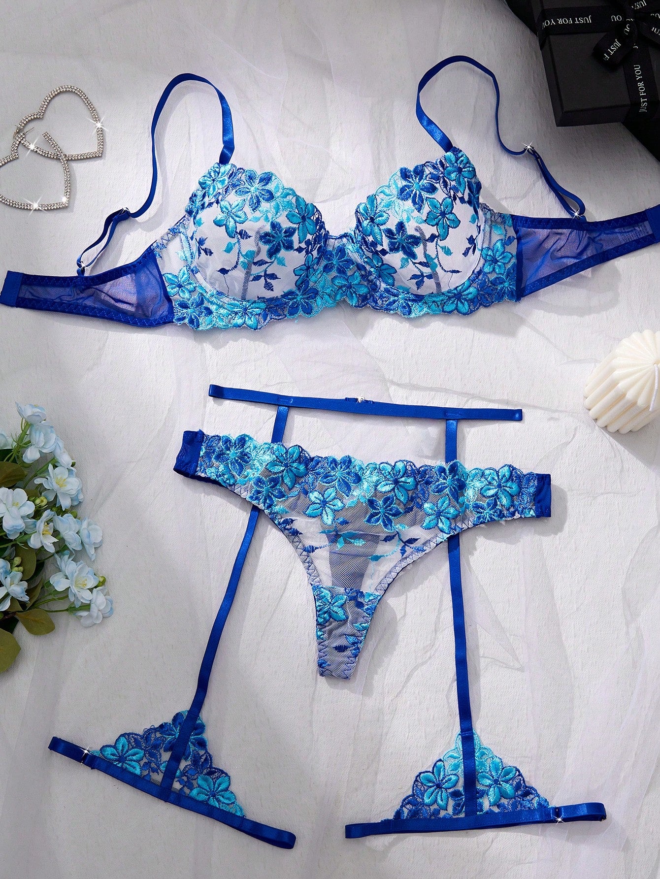 Three-piece women’s sexy lingerie set featuring floral embroidery and sheer details, with a spaghetti strap underwire bralette and matching low-rise briefs.