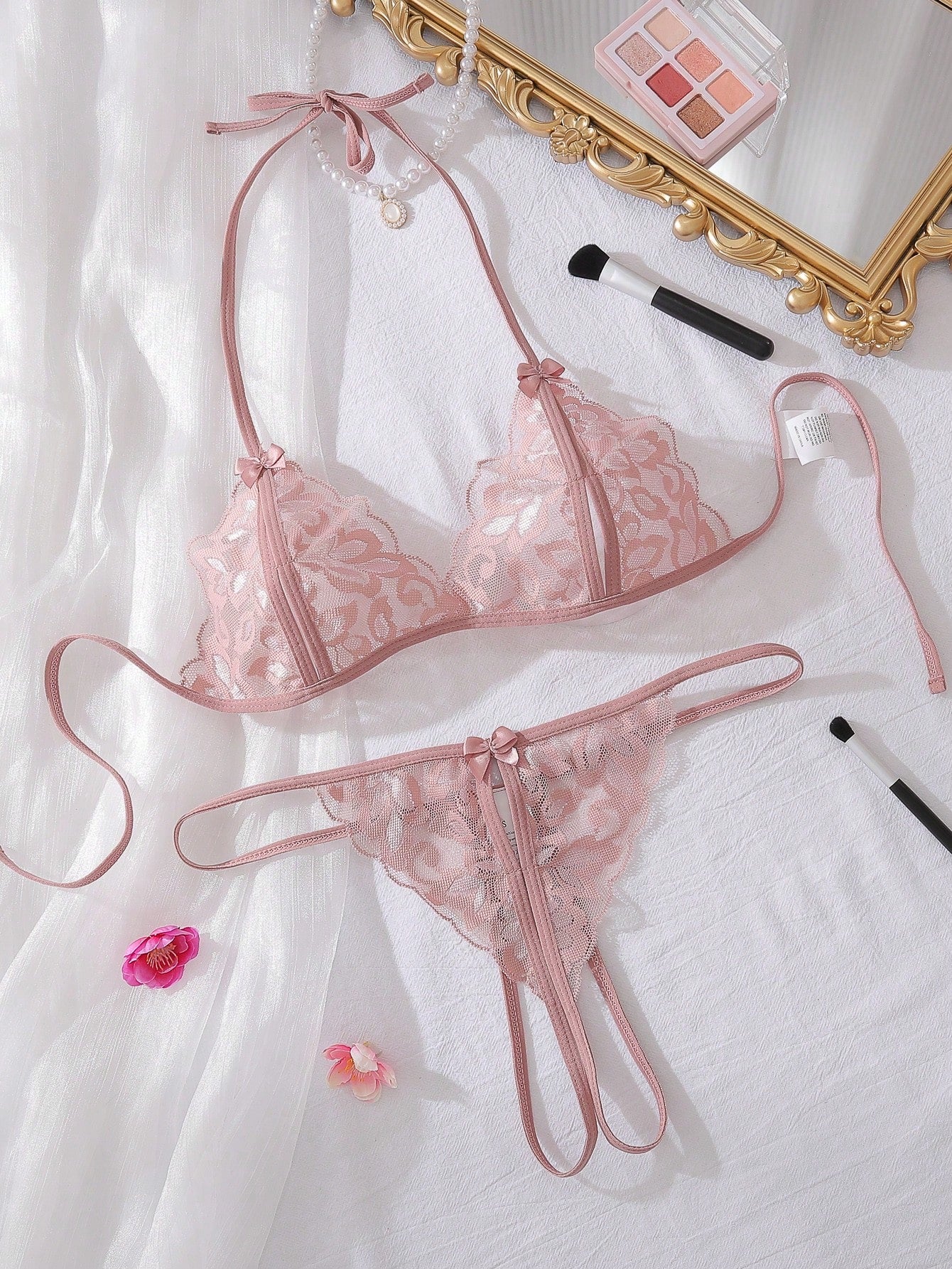 Coffee brown women's 2-piece lingerie set featuring a halter bralette with bowknot detail, contrast lace, triangle cups, cut-out accents, and tie-back design, paired with a matching low-rise thong.