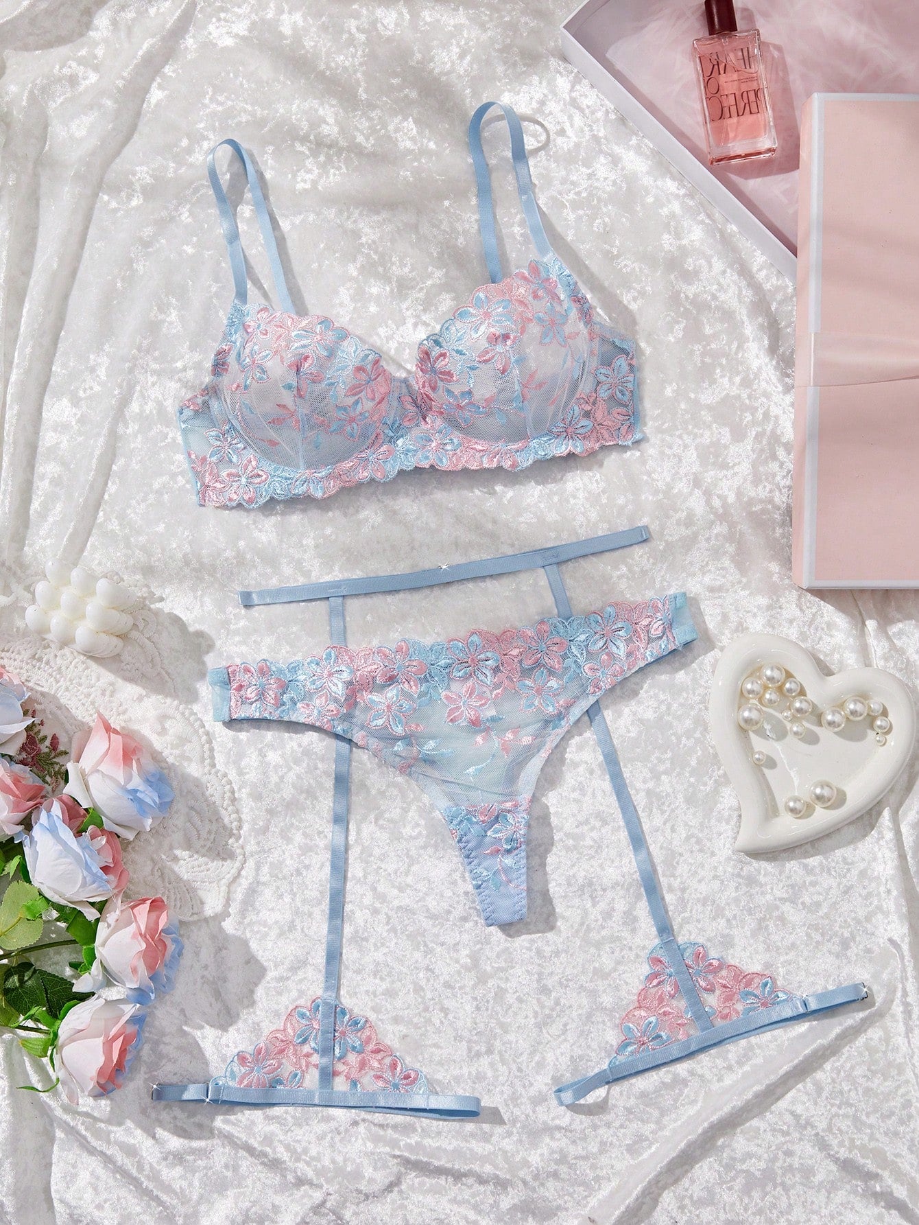 Three-piece women’s sexy lingerie set featuring floral embroidery and sheer details, with a spaghetti strap underwire bralette and matching low-rise briefs.