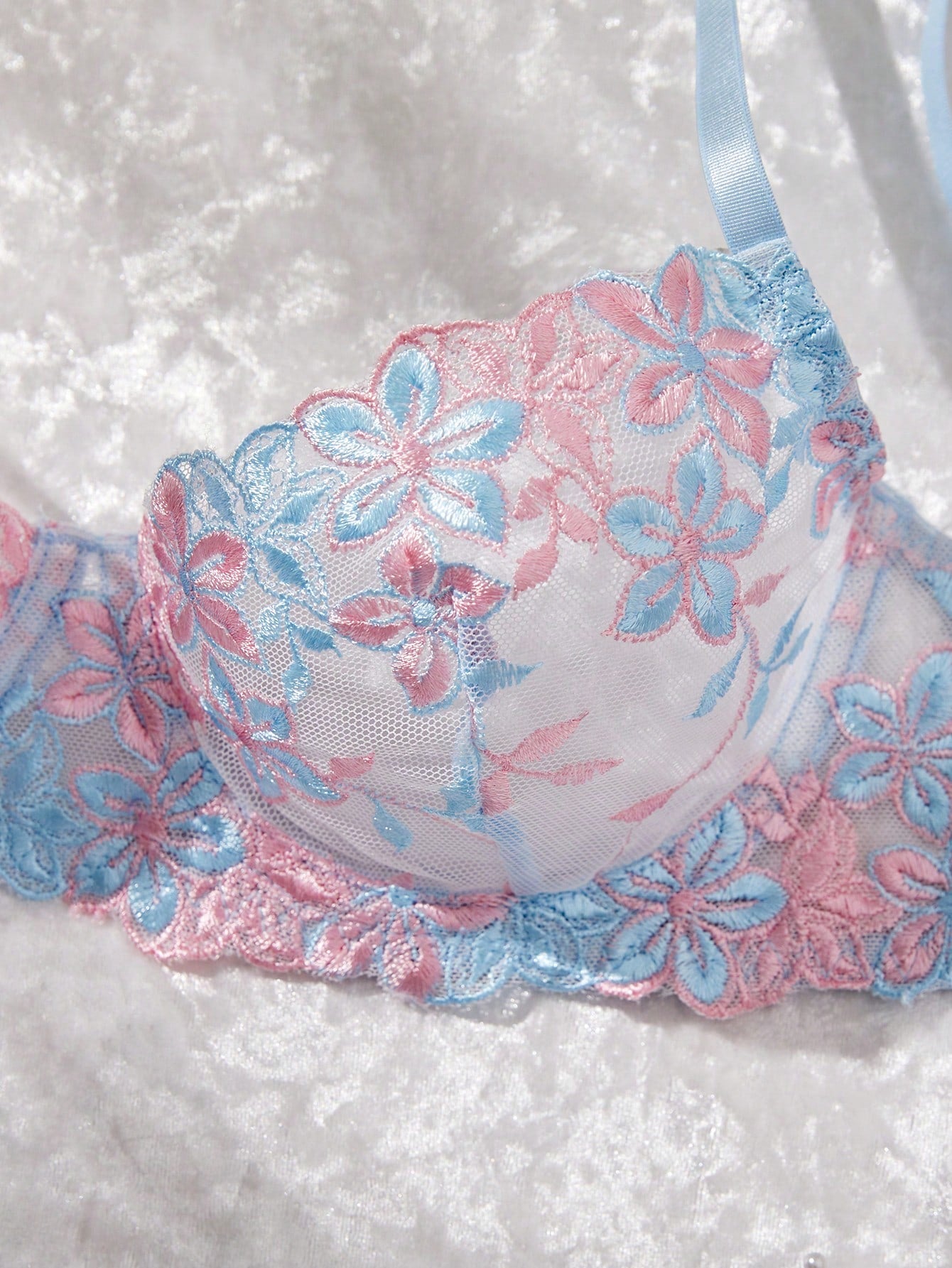 Three-piece women’s sexy lingerie set featuring floral embroidery and sheer details, with a spaghetti strap underwire bralette and matching low-rise briefs.