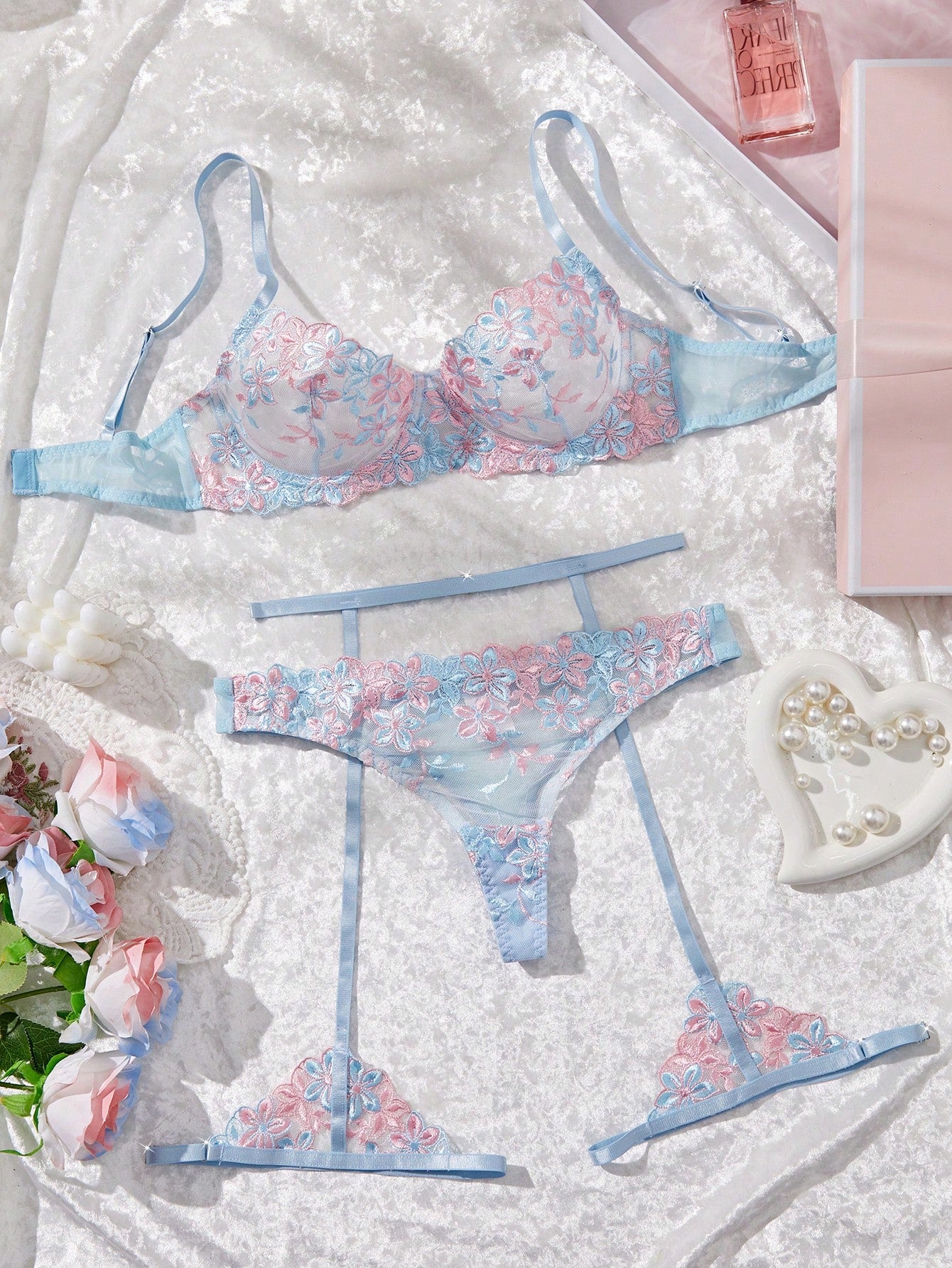 Three-piece women’s sexy lingerie set featuring floral embroidery and sheer details, with a spaghetti strap underwire bralette and matching low-rise briefs.