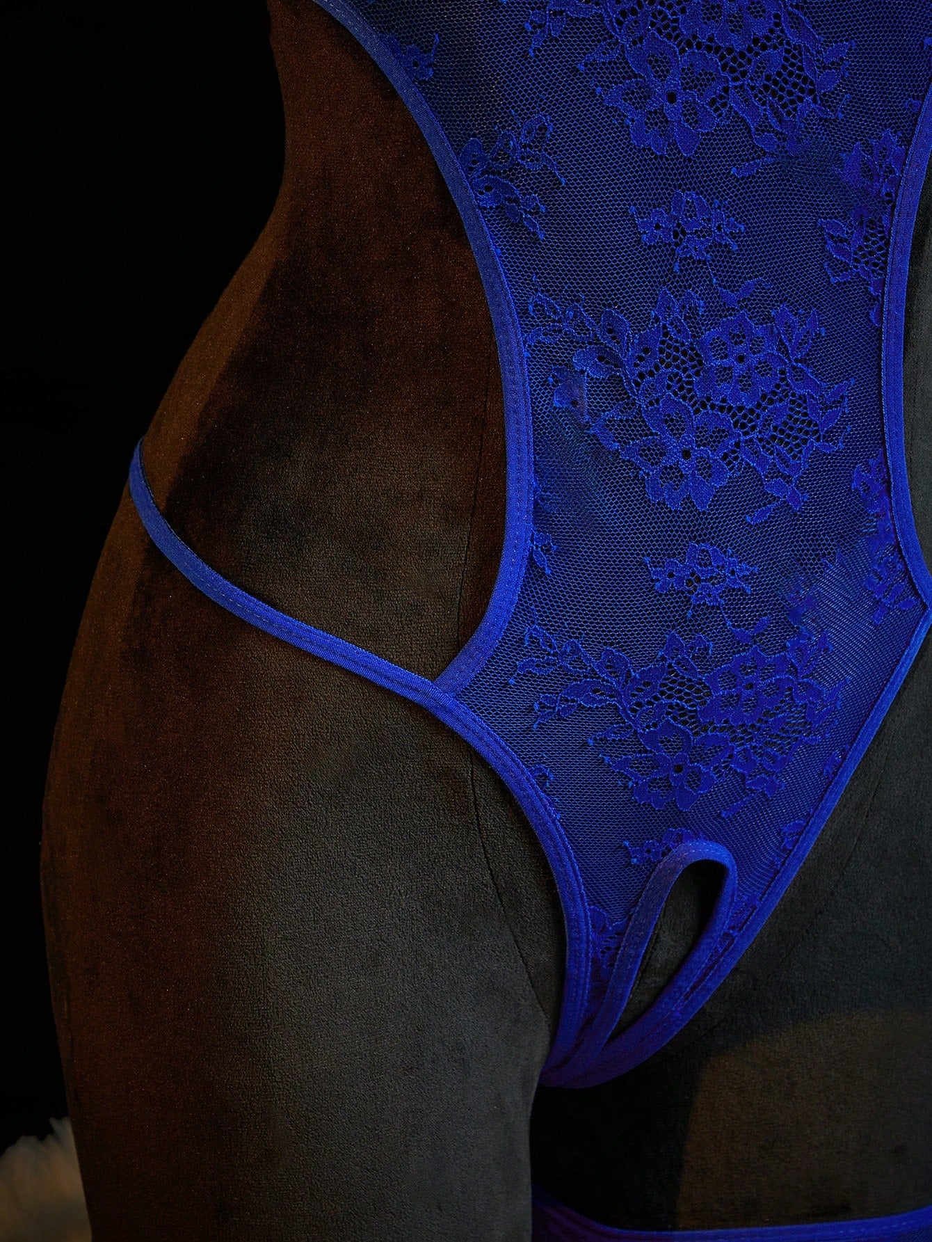 Neon green women’s lace bodysuit lingerie with hollow-out cut-out design, halter neckline, and adjustable straps, shown as a sexy going-out style.