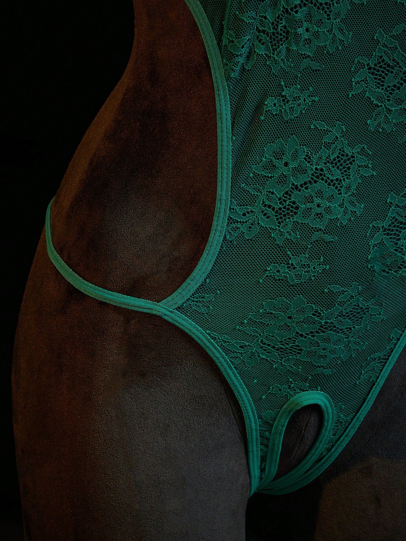 Neon green women’s lace bodysuit lingerie with hollow-out cut-out design, halter neckline, and adjustable straps, shown as a sexy going-out style.