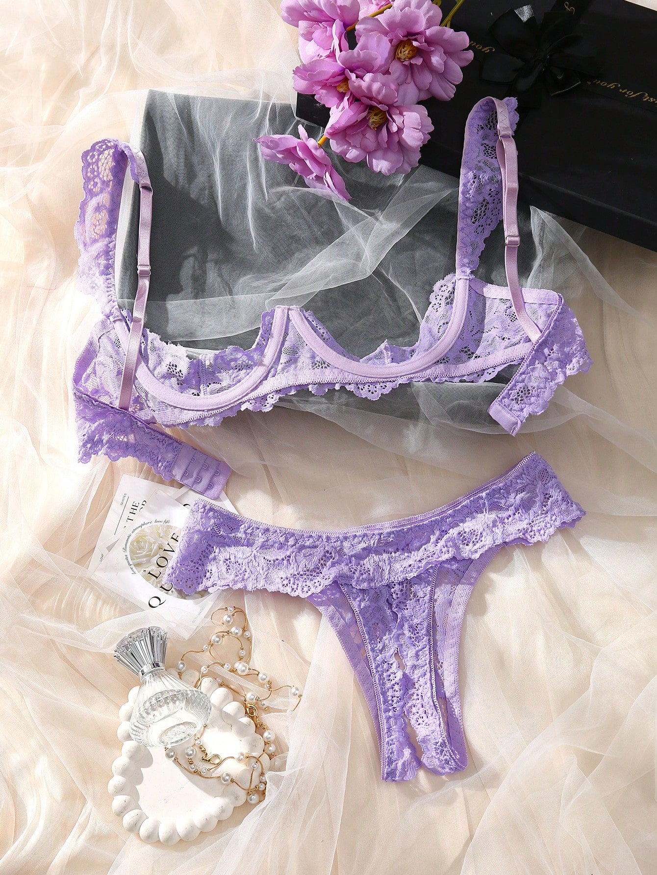 Women’s 2-piece contrast lace lingerie set with a sheer plain design, featuring an underwire open-cup bra with adjustable spaghetti straps and matching low-rise V-string panties.