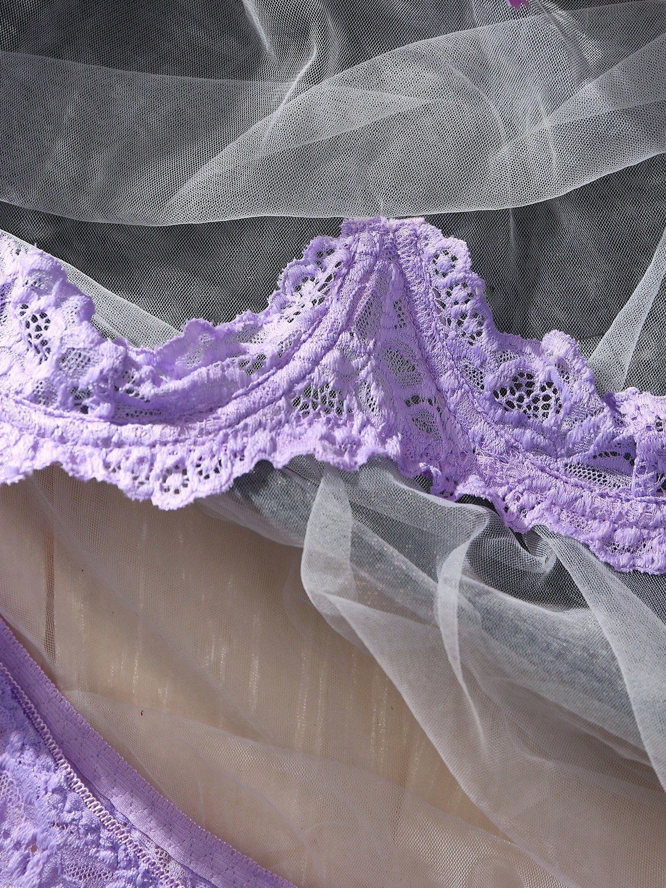Women’s 2-piece contrast lace lingerie set with a sheer plain design, featuring an underwire open-cup bra with adjustable spaghetti straps and matching low-rise V-string panties.