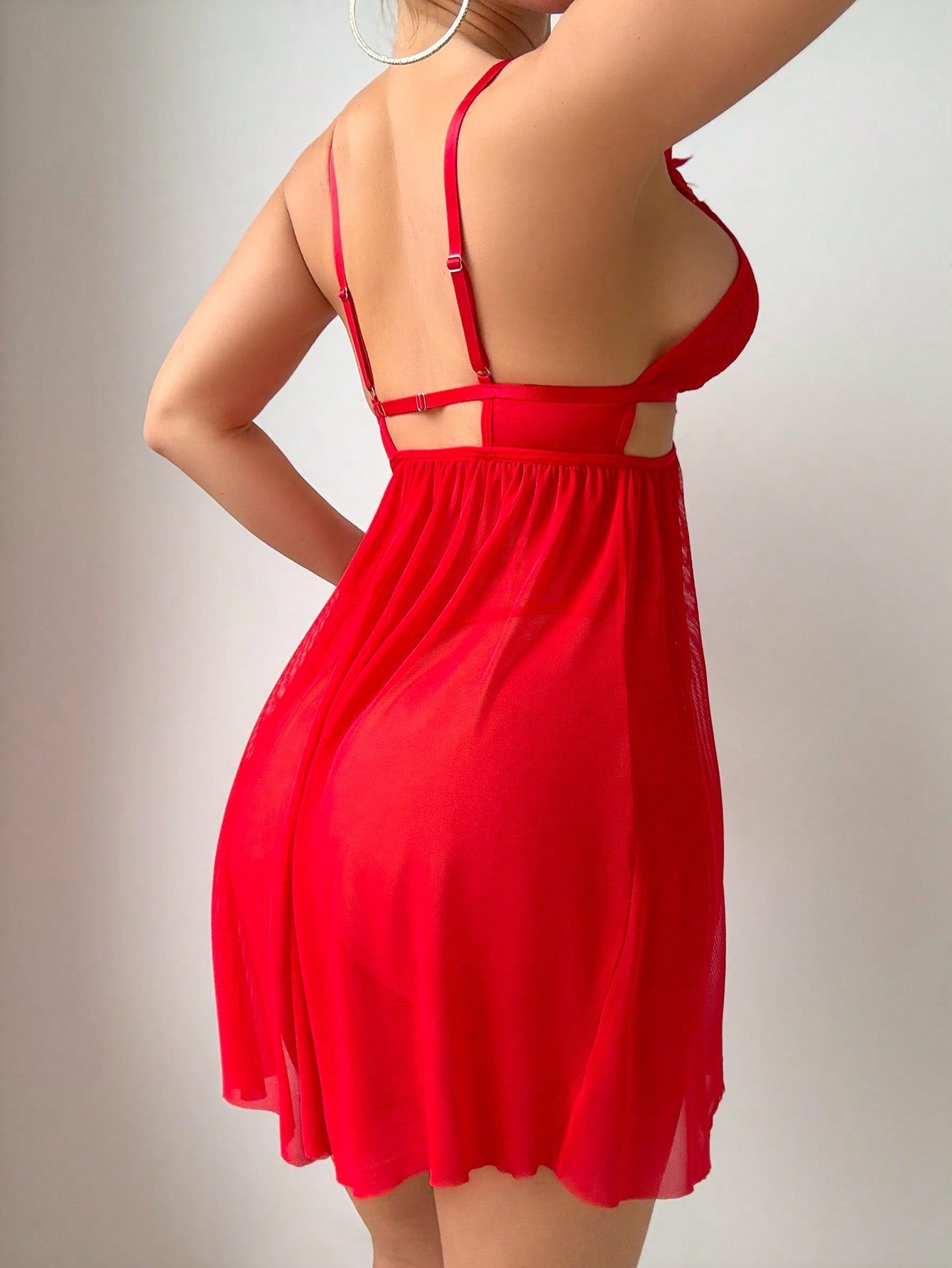 Women’s 2-piece lingerie set featuring a romantic lace patchwork babydoll nightgown with spaghetti straps, bow and cut-out details, and a matching low-rise thong.