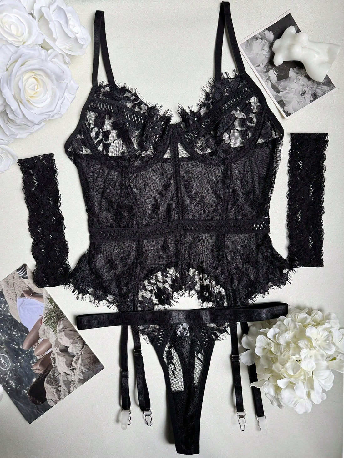 Women’s 3-piece sexy lingerie set featuring a lace longline underwire bustier with adjustable spaghetti straps, matching thong panty, and garter belt with contrast mesh and plant pattern details.