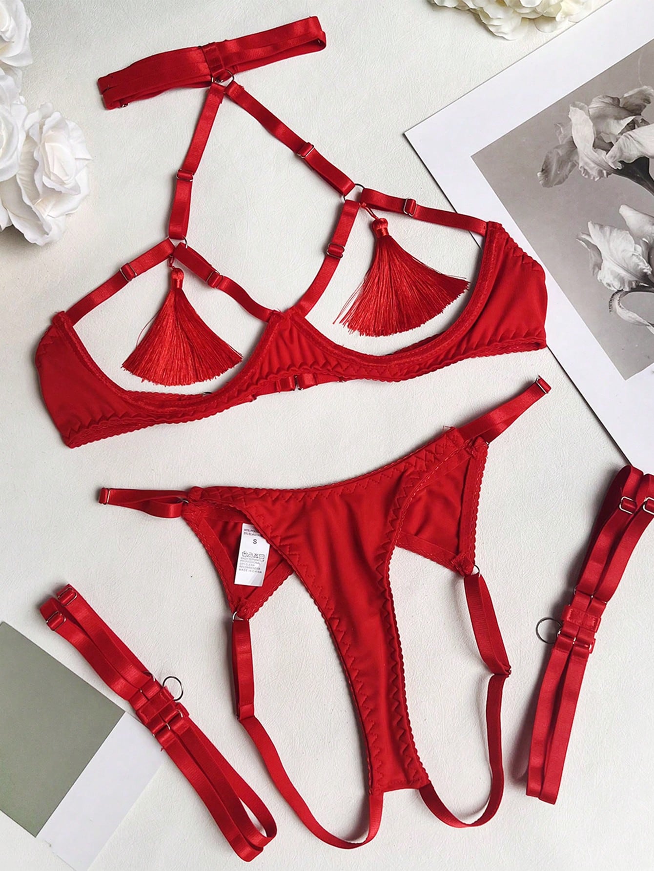 Red fringe satin exposed-bust lingerie set with open collar, spaghetti straps, underwire longline triangle-cup bra, and matching low-rise thong; 3-piece set, gloves not included.