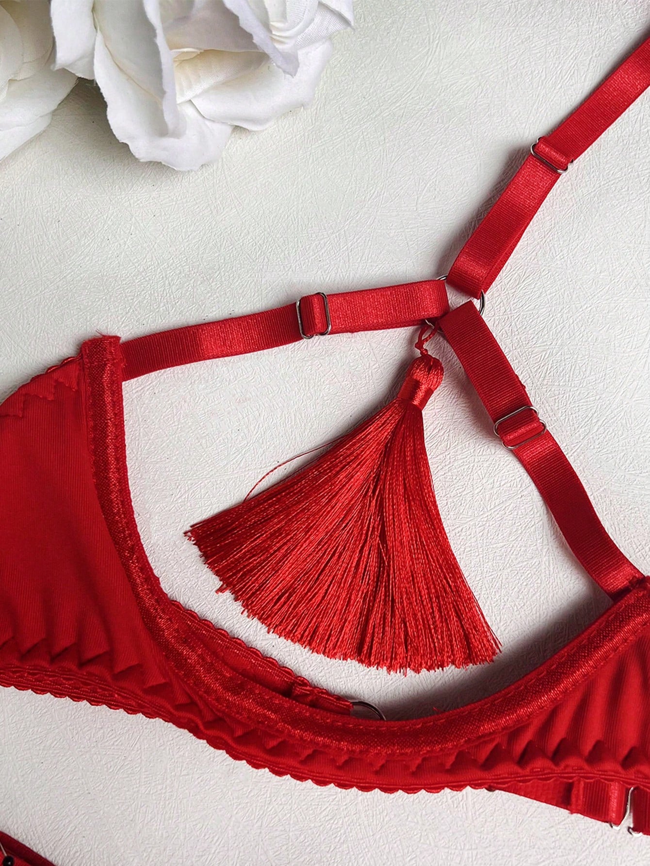 Red fringe satin exposed-bust lingerie set with open collar, spaghetti straps, underwire longline triangle-cup bra, and matching low-rise thong; 3-piece set, gloves not included.