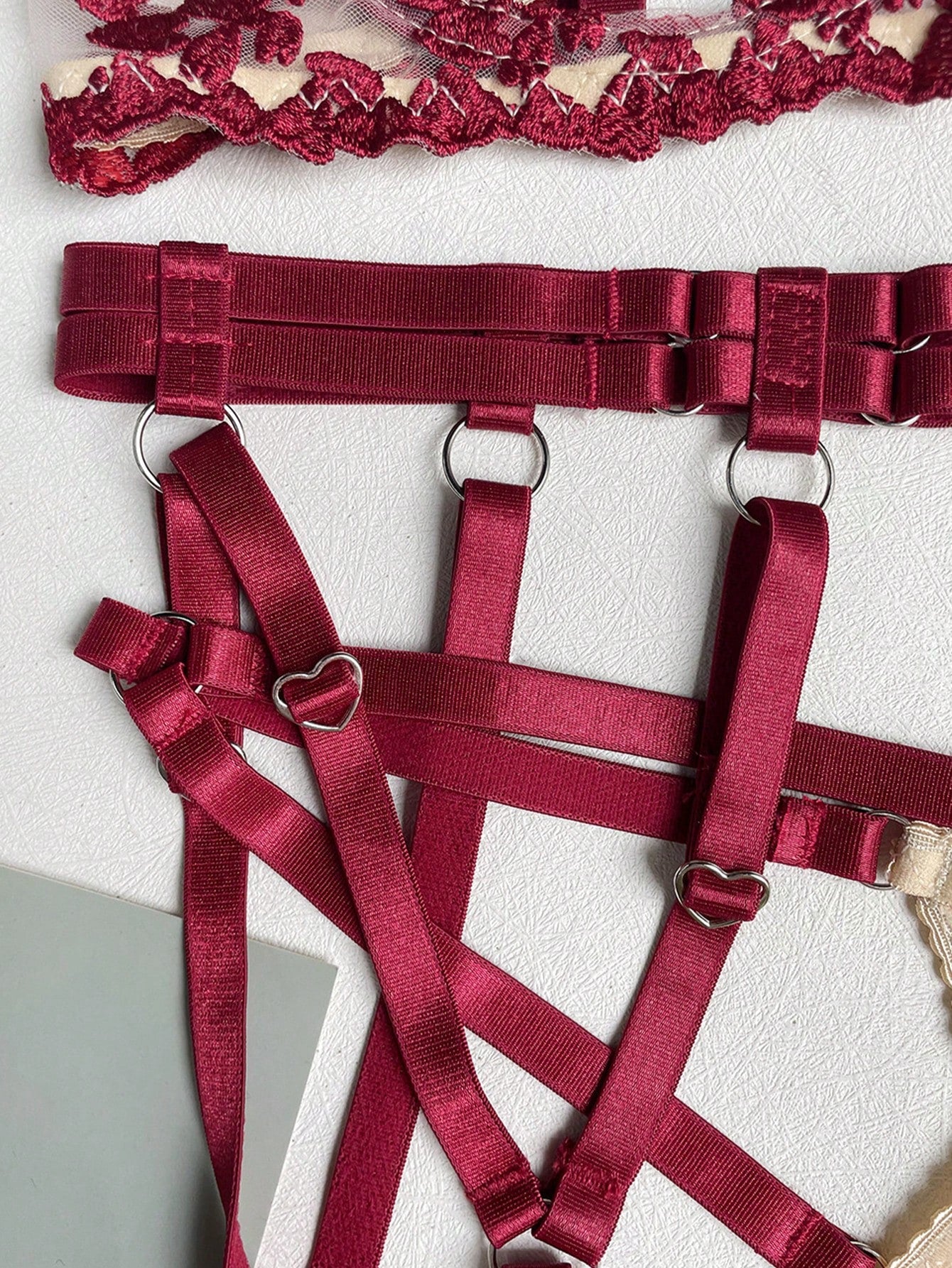 Red romantic embroidered lingerie set featuring a sheer underwire triangle bra with adjustable spaghetti straps, matching embroidered thong, waistband, leg straps, and a complimentary collar; 5-piece sexy Valentine-style set.