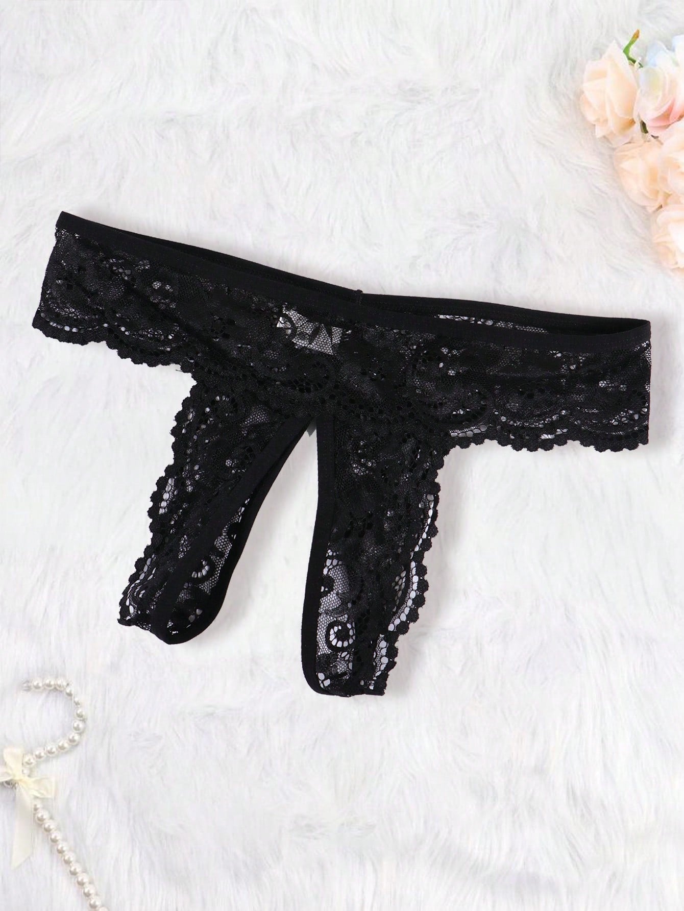 Women's black 2-piece lace lingerie set featuring a sheer wireless bralette with bowknot detail and adjustable spaghetti straps, paired with low-rise open crotch tanga thong panties.