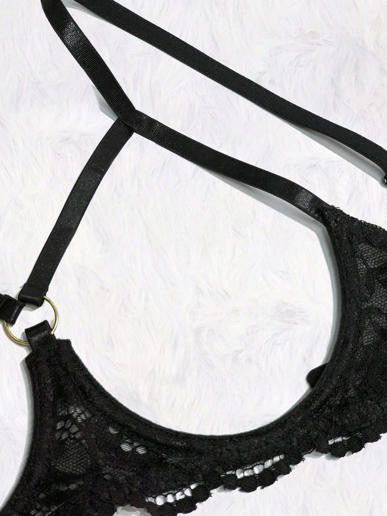 Women's black 2-piece lace lingerie set featuring a sheer wireless bralette with bowknot detail and adjustable spaghetti straps, paired with low-rise open crotch tanga thong panties.