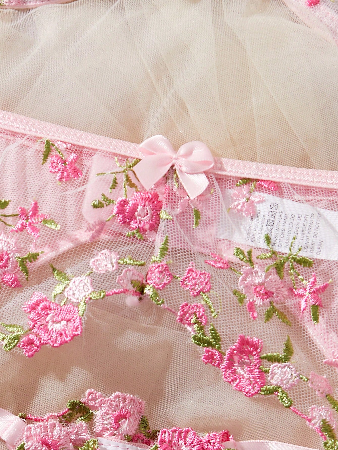3-piece women’s lingerie set featuring a bandeau top and G-string thong, with embroidery, sheer details, knot accents, underwire demi bra styling, and adjustable spaghetti straps.
