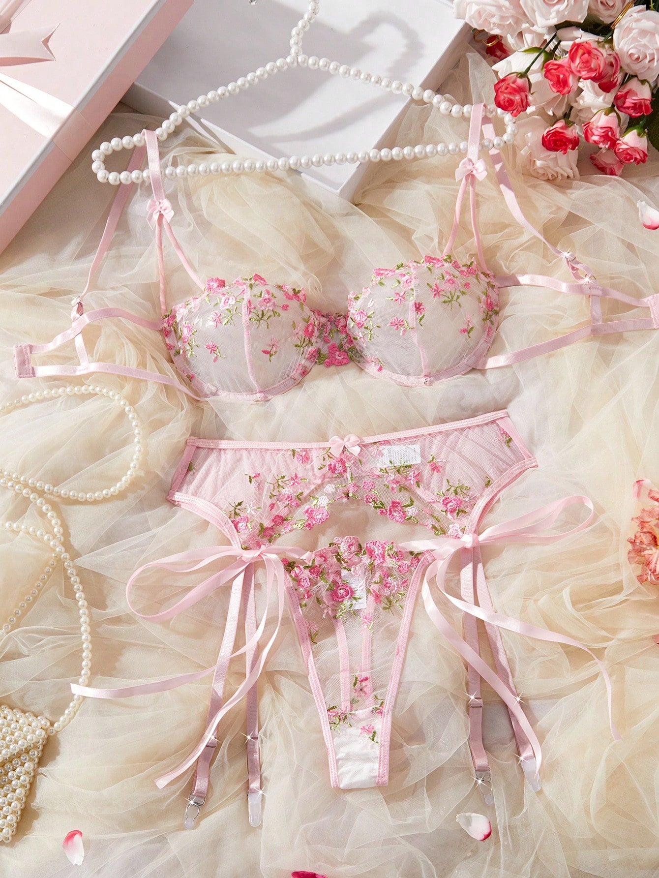 3-piece women’s lingerie set featuring a bandeau top and G-string thong, with embroidery, sheer details, knot accents, underwire demi bra styling, and adjustable spaghetti straps.