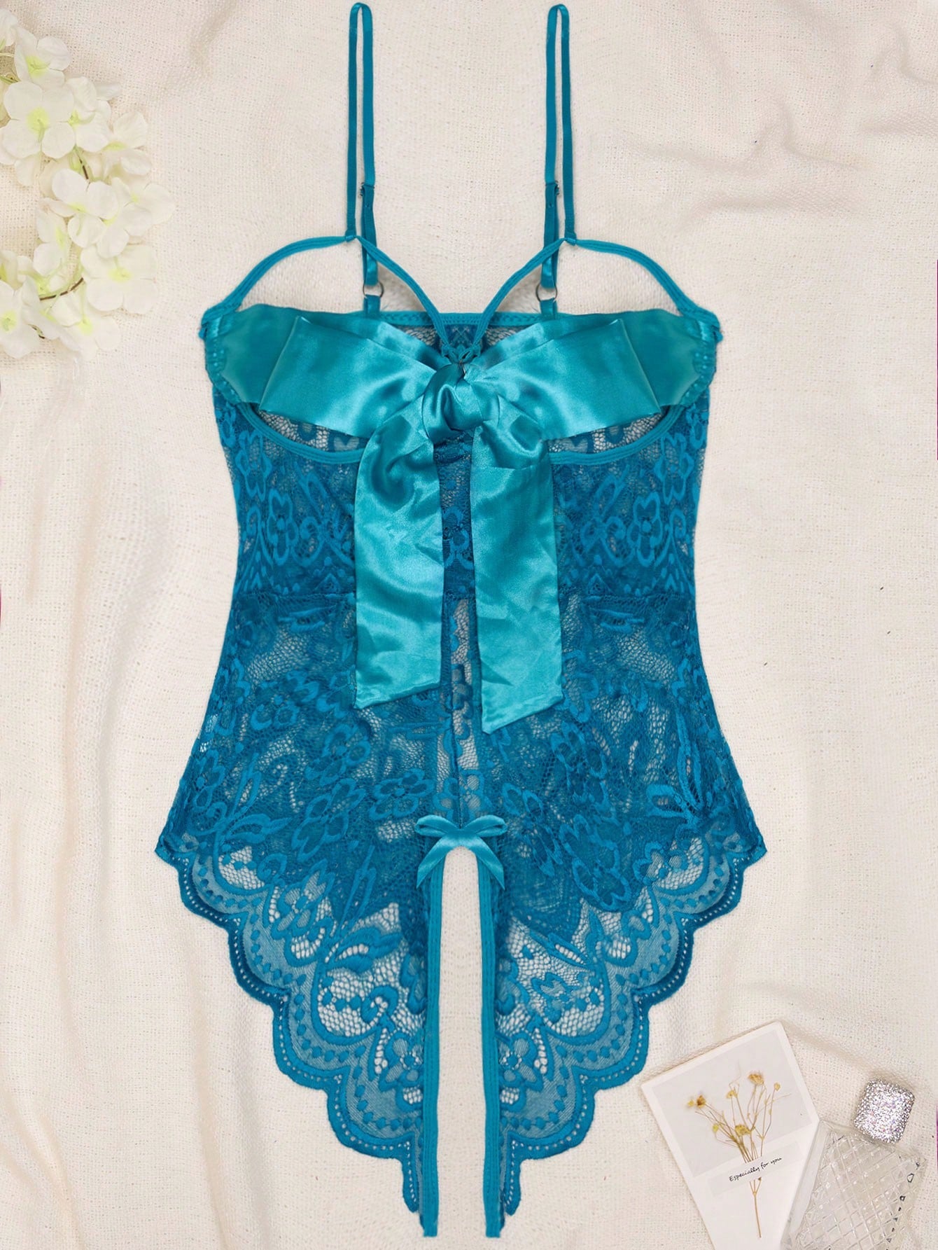 1-piece women’s sexy lingerie bodysuit with contrast lace, see-through design, cut-out details, spaghetti straps, and open crotch style.
