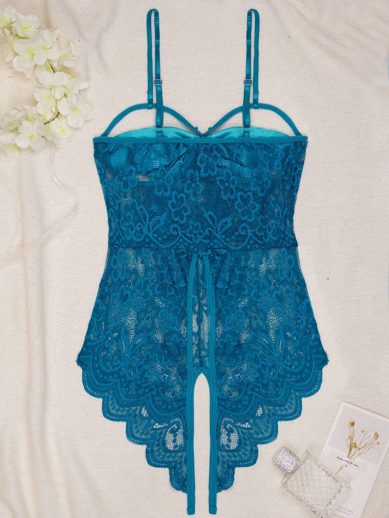 1-piece women’s sexy lingerie bodysuit with contrast lace, see-through design, cut-out details, spaghetti straps, and open crotch style.